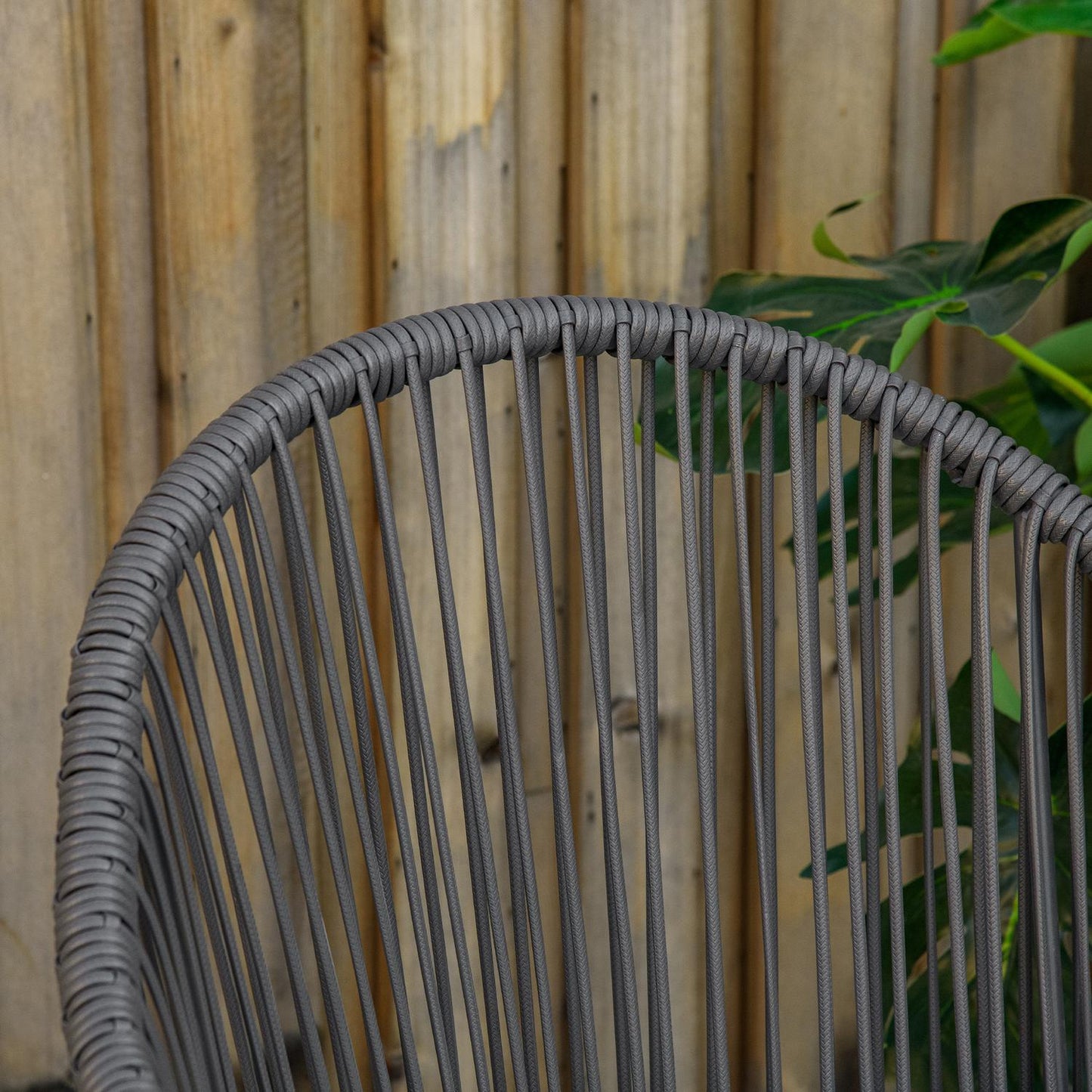 Rattan garden furniture - 2 chairs and table, cushions included