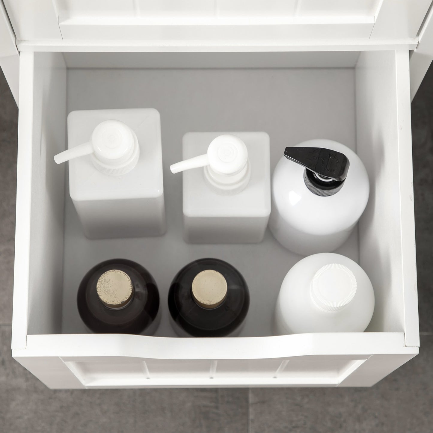 Tall white bathroom cabinet with drawers and shelves
