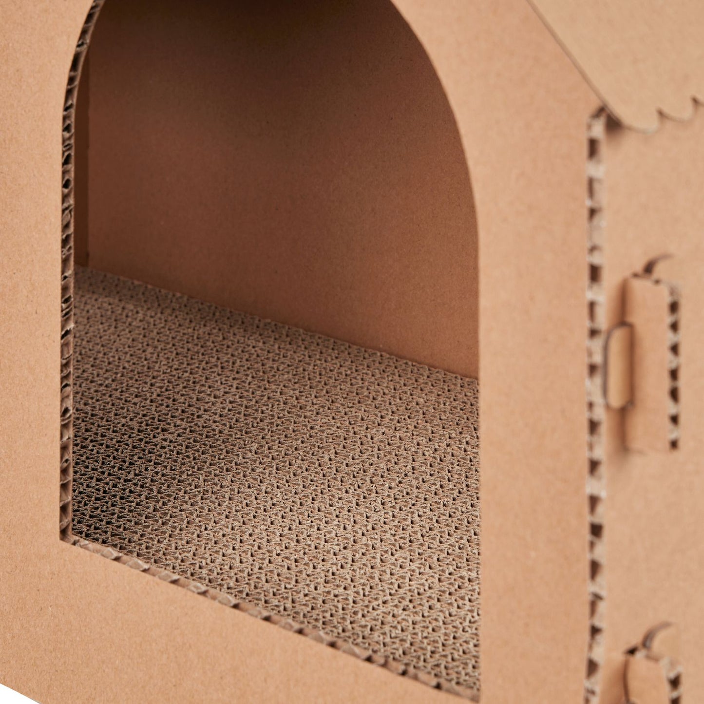 Cardboard cat house with scratching board