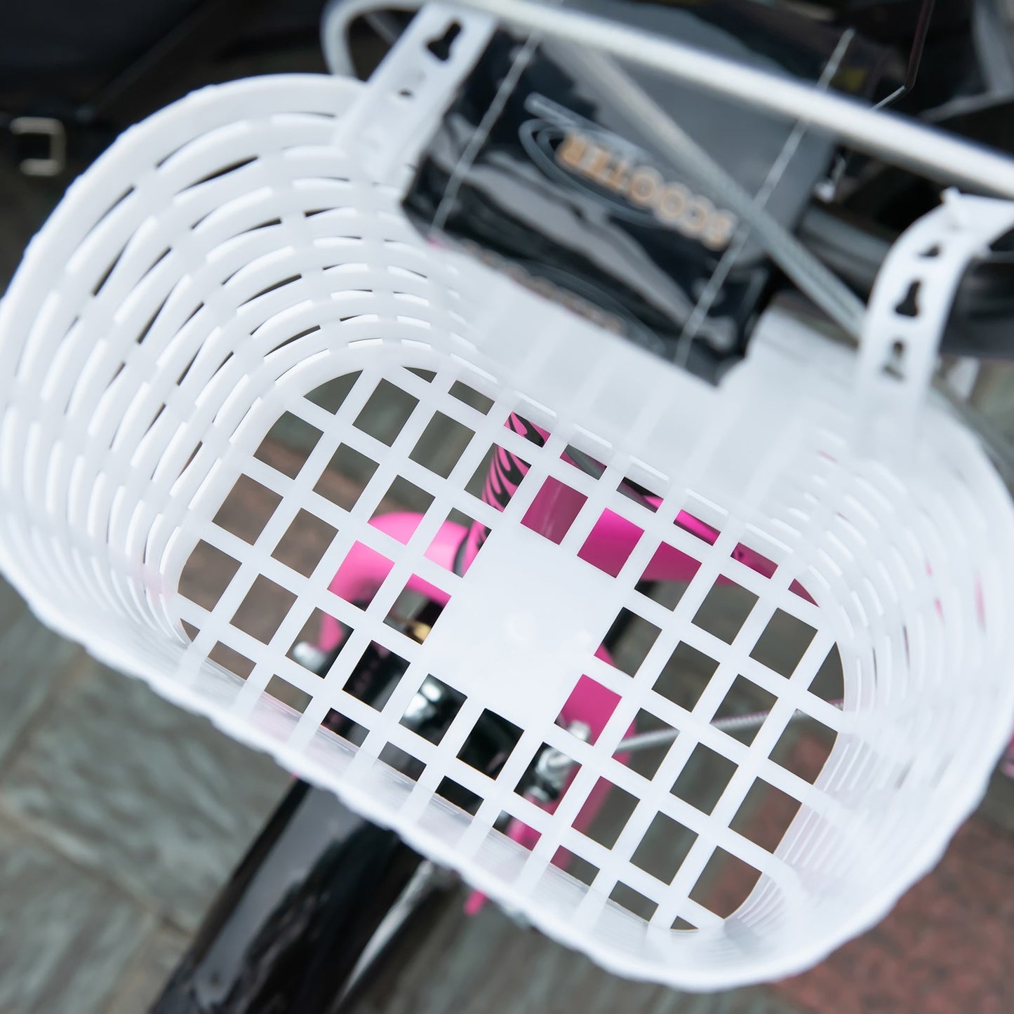 Children's scooter in pink and white, adjustable height, with basket