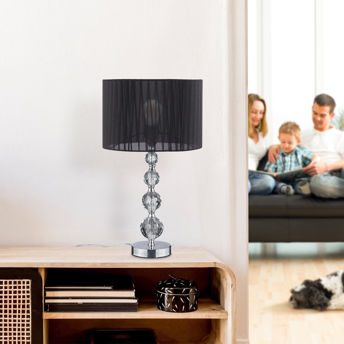 <p>The crystal design table lamp elevates any room with its elegant style and warm ambiance. Featuring a crystal-like glass base and black organza shade, it blends modern design with classic elegance.</p>
<ul>
<li>Enhance decor with a unique crystal-like