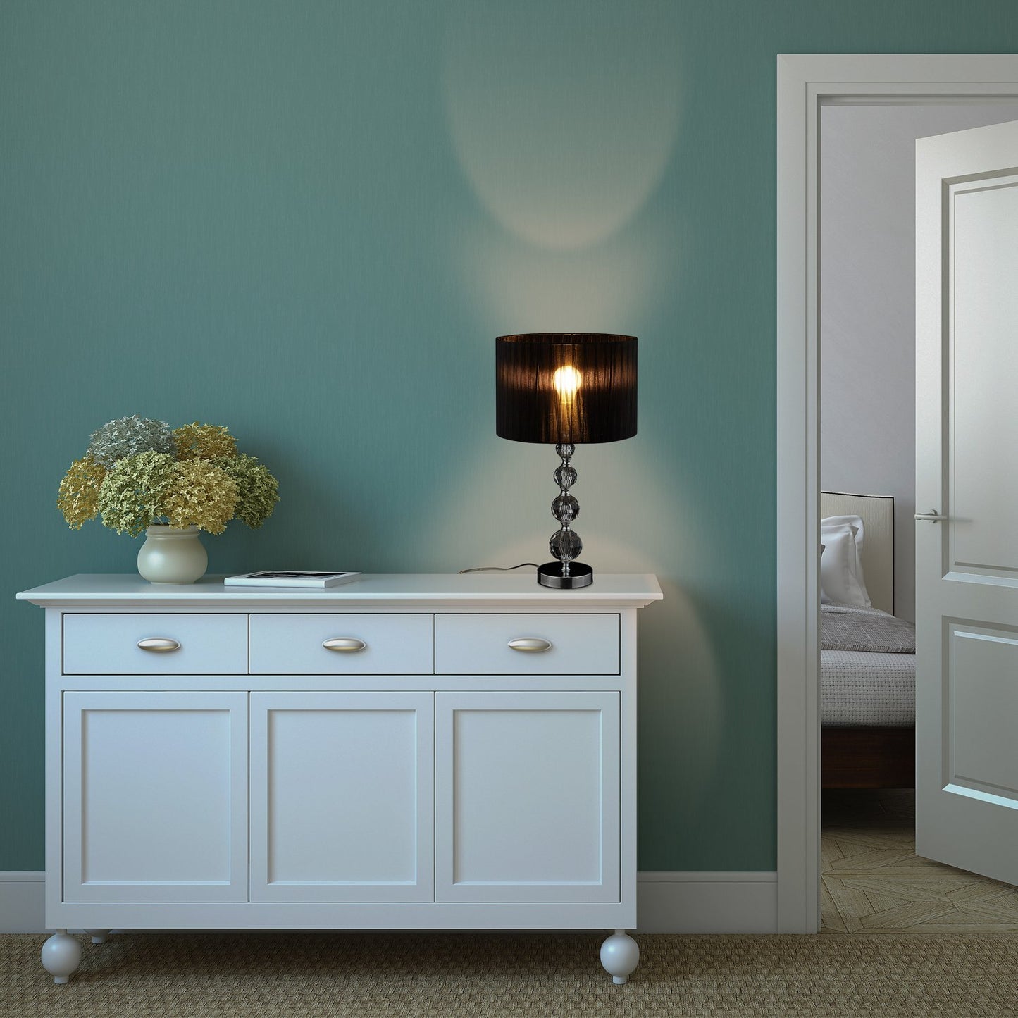 <p>The crystal design table lamp elevates any room with its elegant style and warm ambiance. Featuring a crystal-like glass base and black organza shade, it blends modern design with classic elegance.</p>
<ul>
<li>Enhance decor with a unique crystal-like