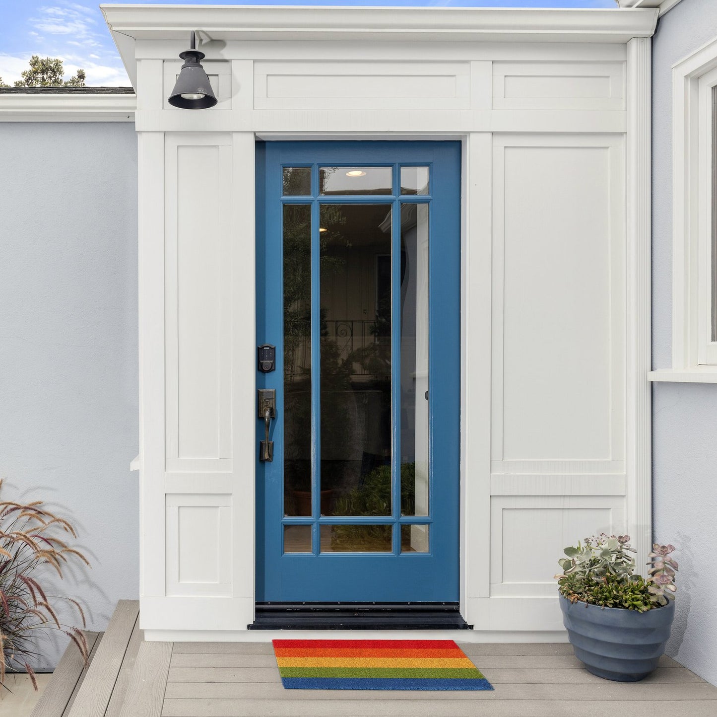 Door mat made of coconut in rainbows
