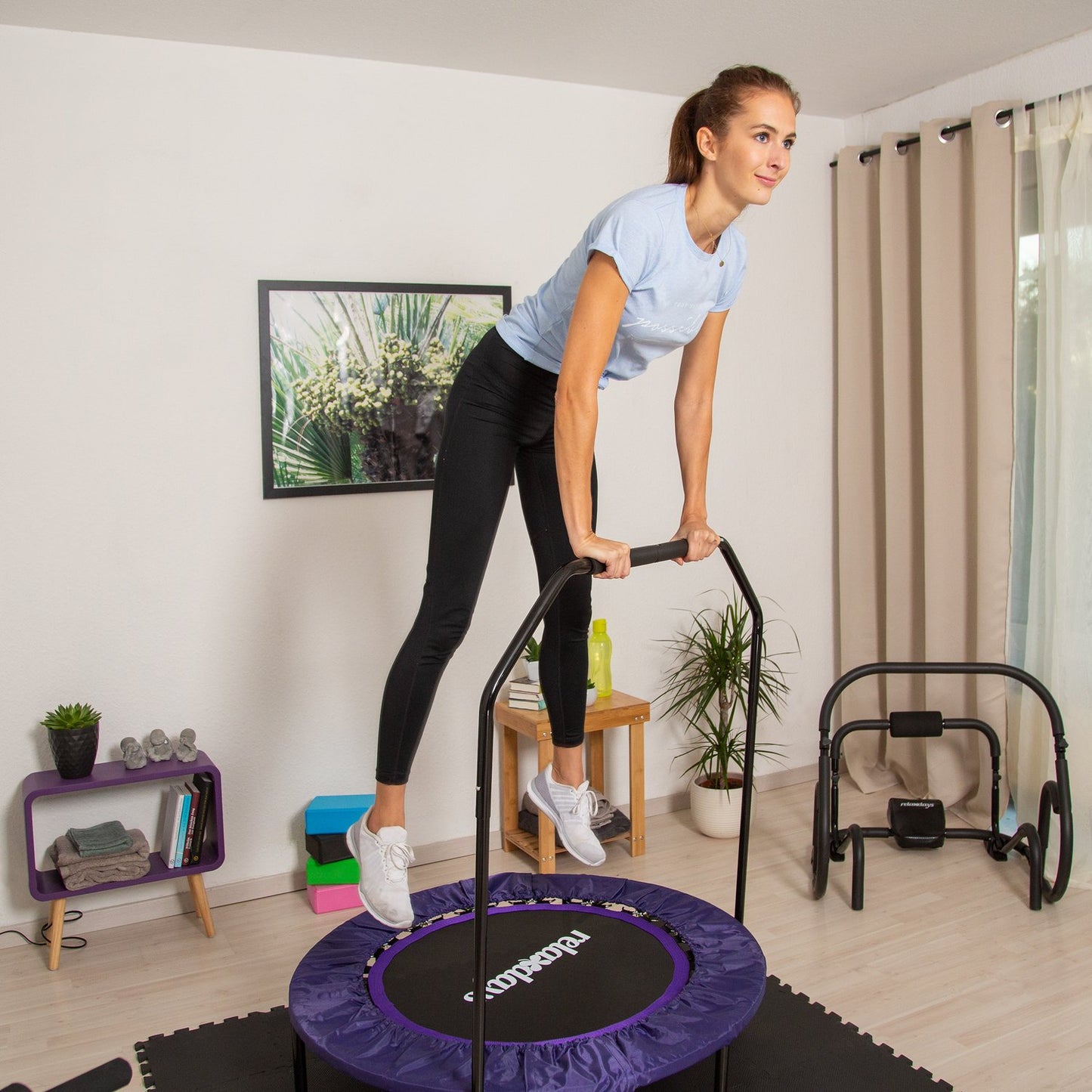 Foldable trampoline with handle