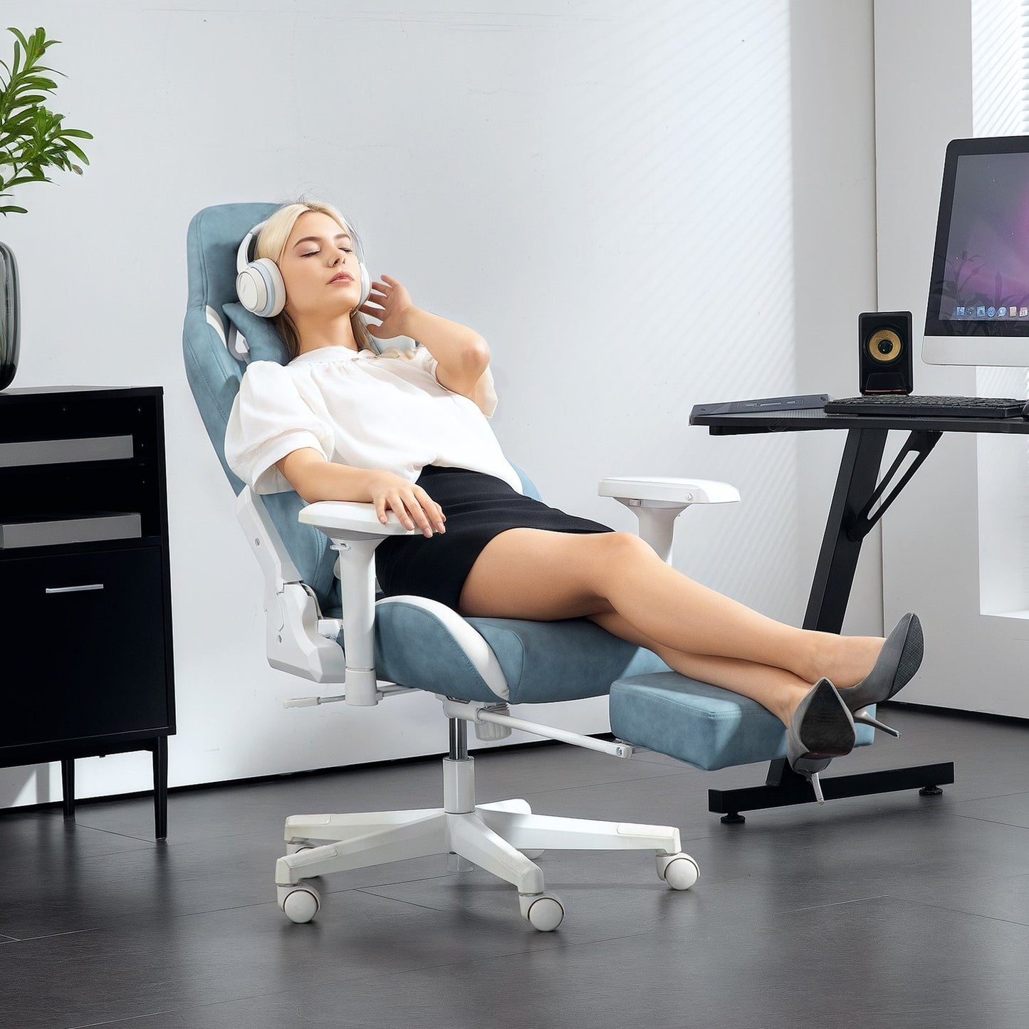 Blue Ergonomic gaming chair, reclining with footrest and cushions