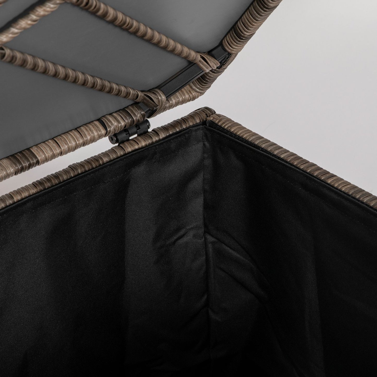 Weather-resistant storage box in poly rattan with auto-lift lid