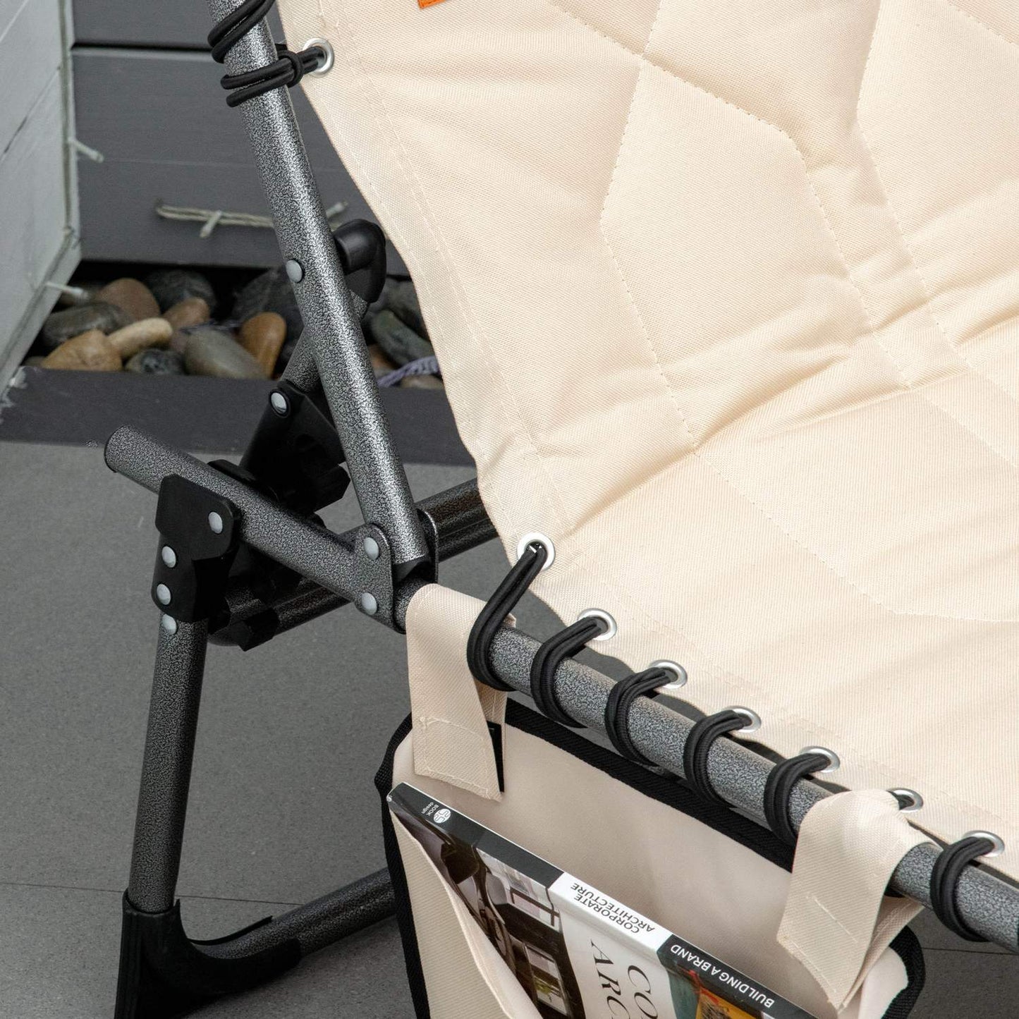 Folding sun lounger with cushion and adjustable backrest