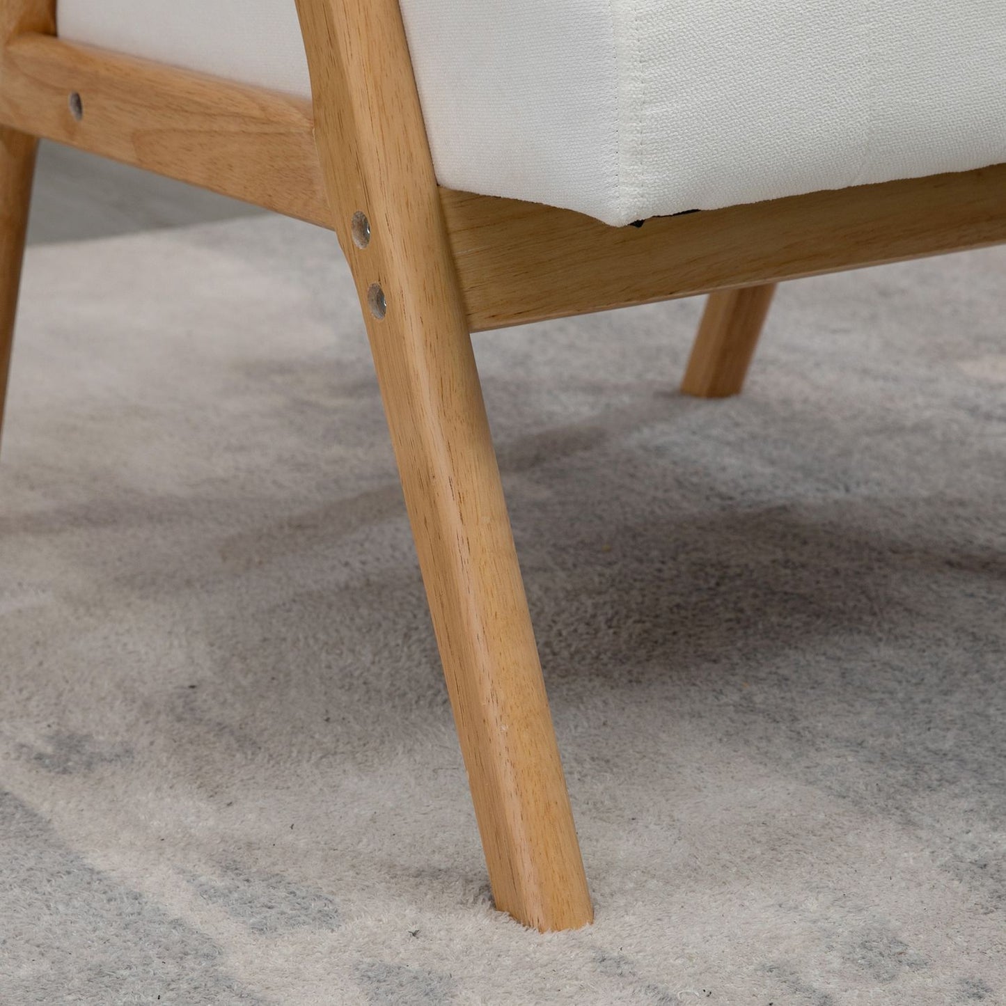 Scandi upholstered lounge chair in velvet look with armrests