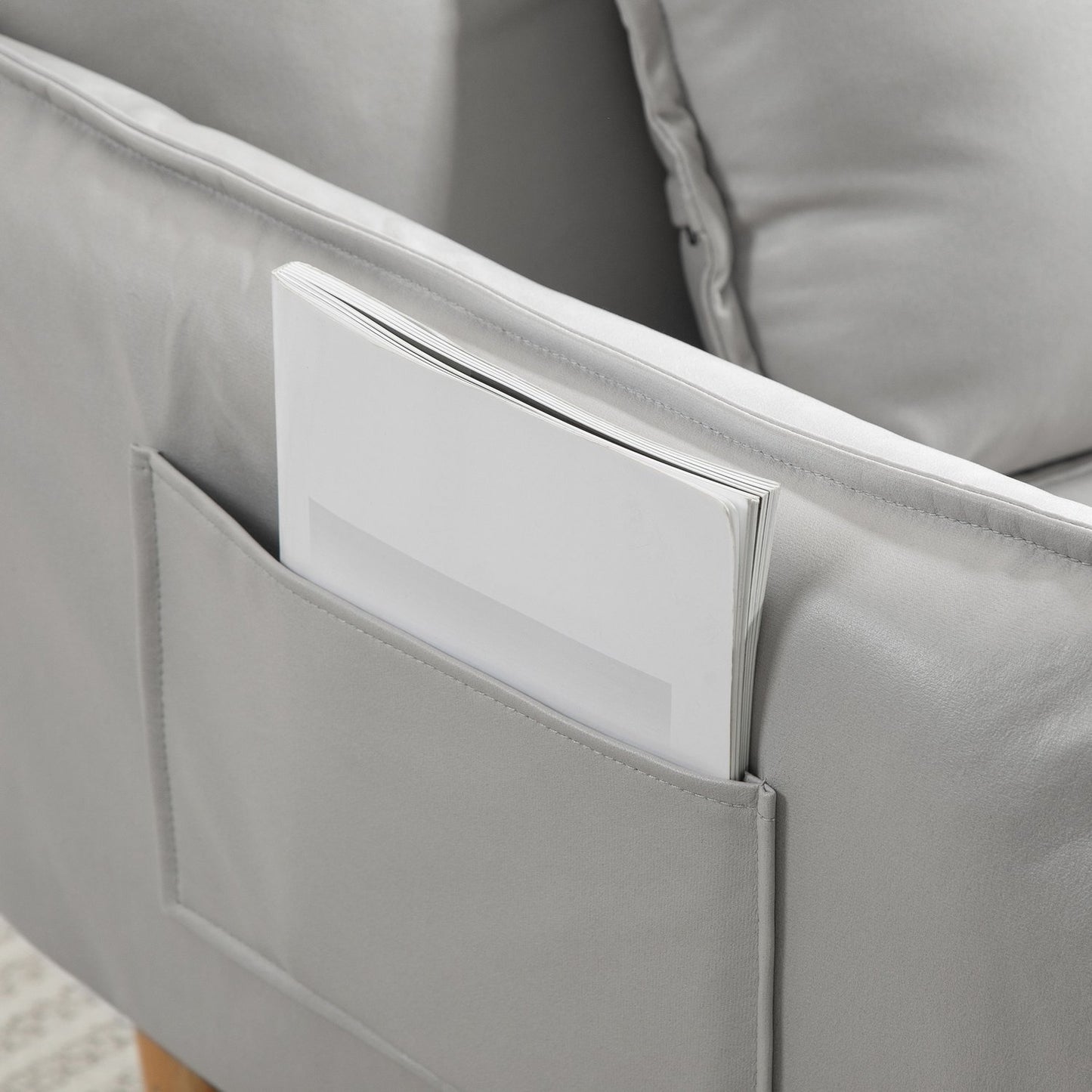 Adjustable light gray upholstered armchair with cushion