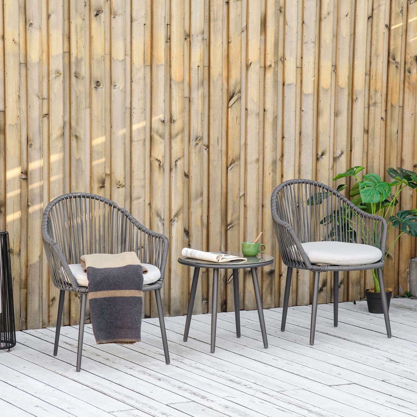 Rattan garden furniture - 2 chairs and table, cushions included