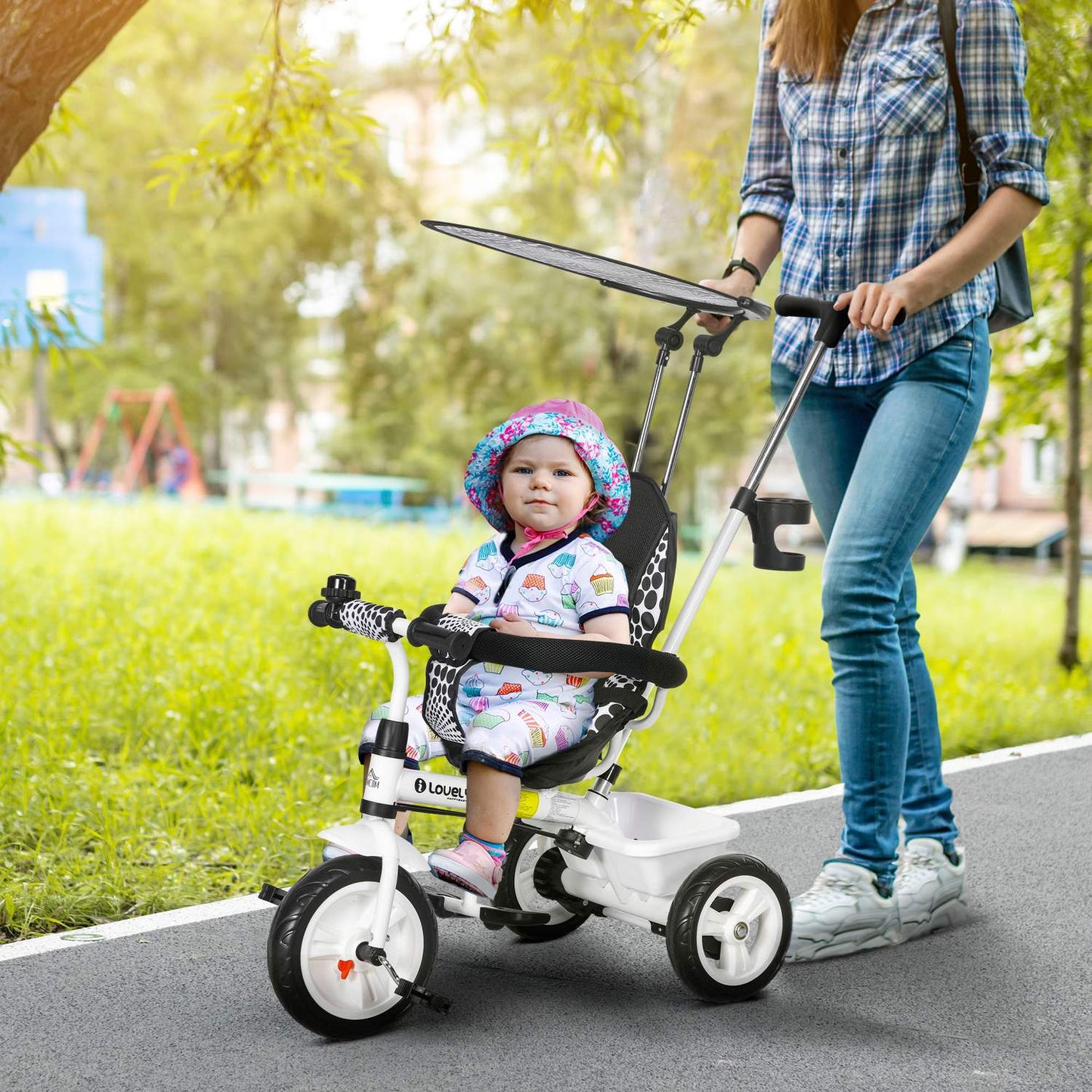 Tricycle for children with sun protection and adjustable seat