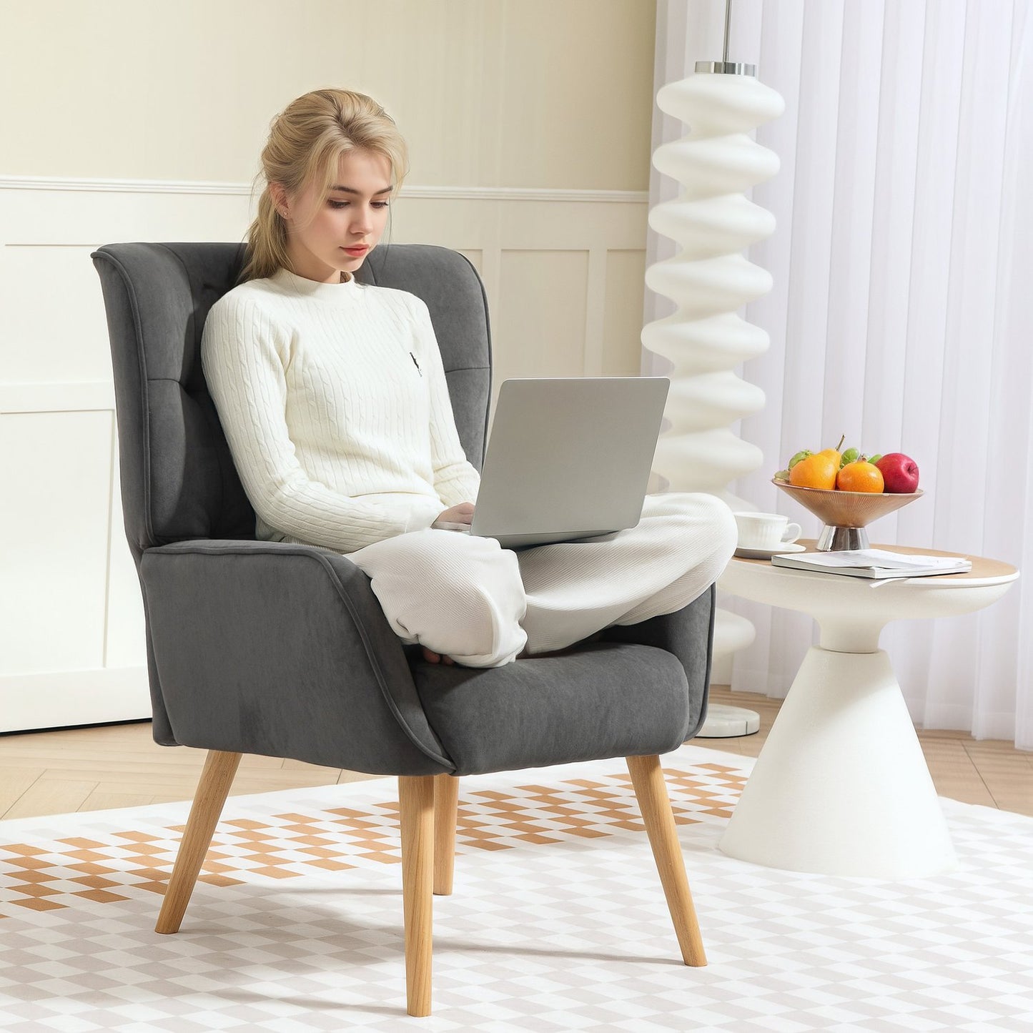 Gray velvet armchair with wooden legs for living room