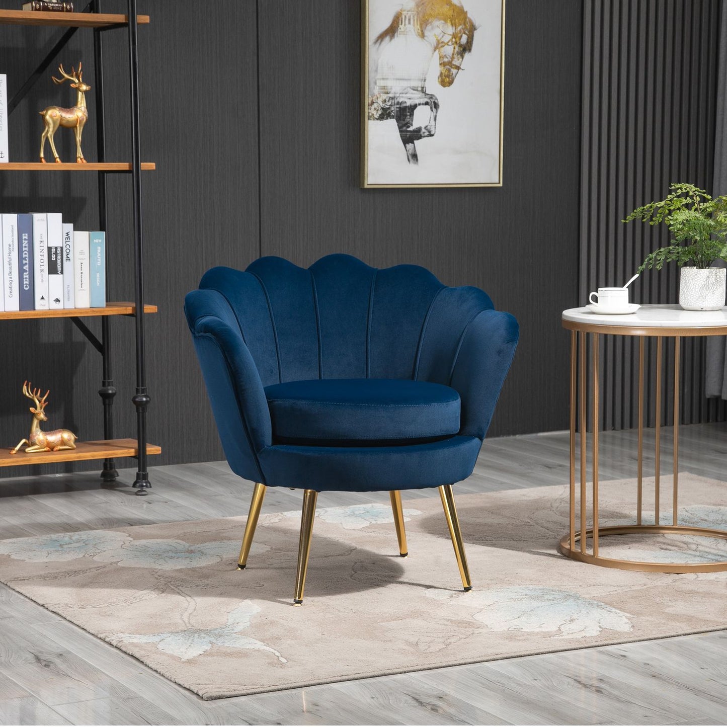Blue shell-shaped upholstered velvet armchair with metal legs