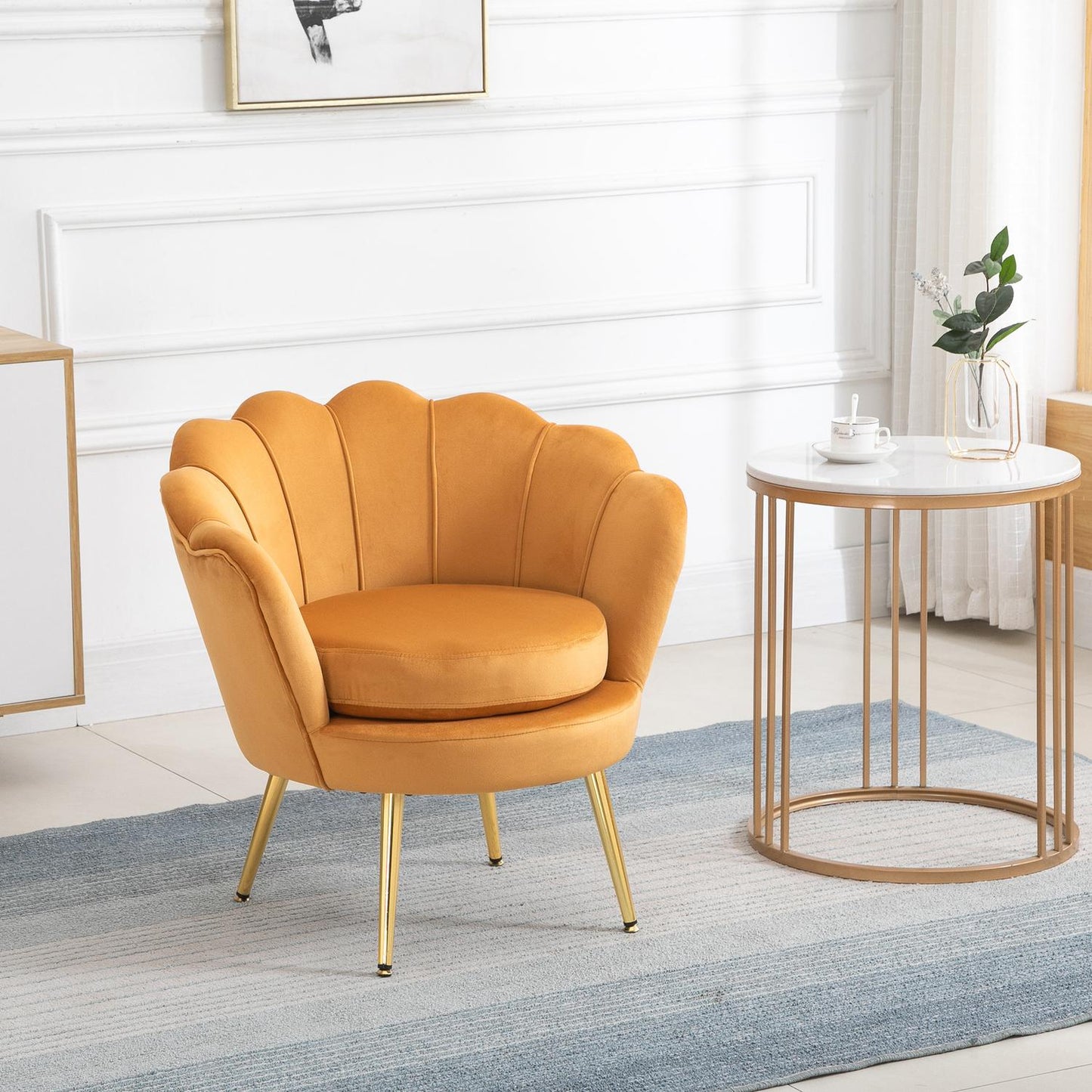 Upholstered shell-shaped armchair with metal legs, yellow