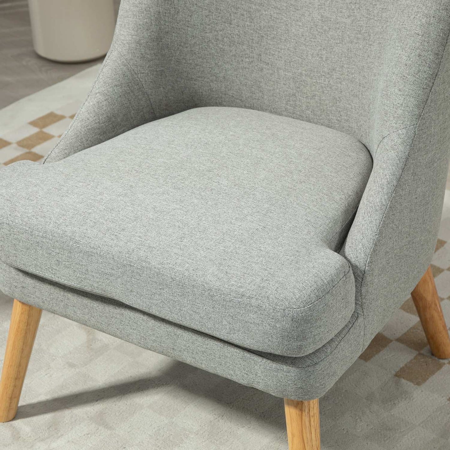 Light gray relaxation armchair in linen style with armrests