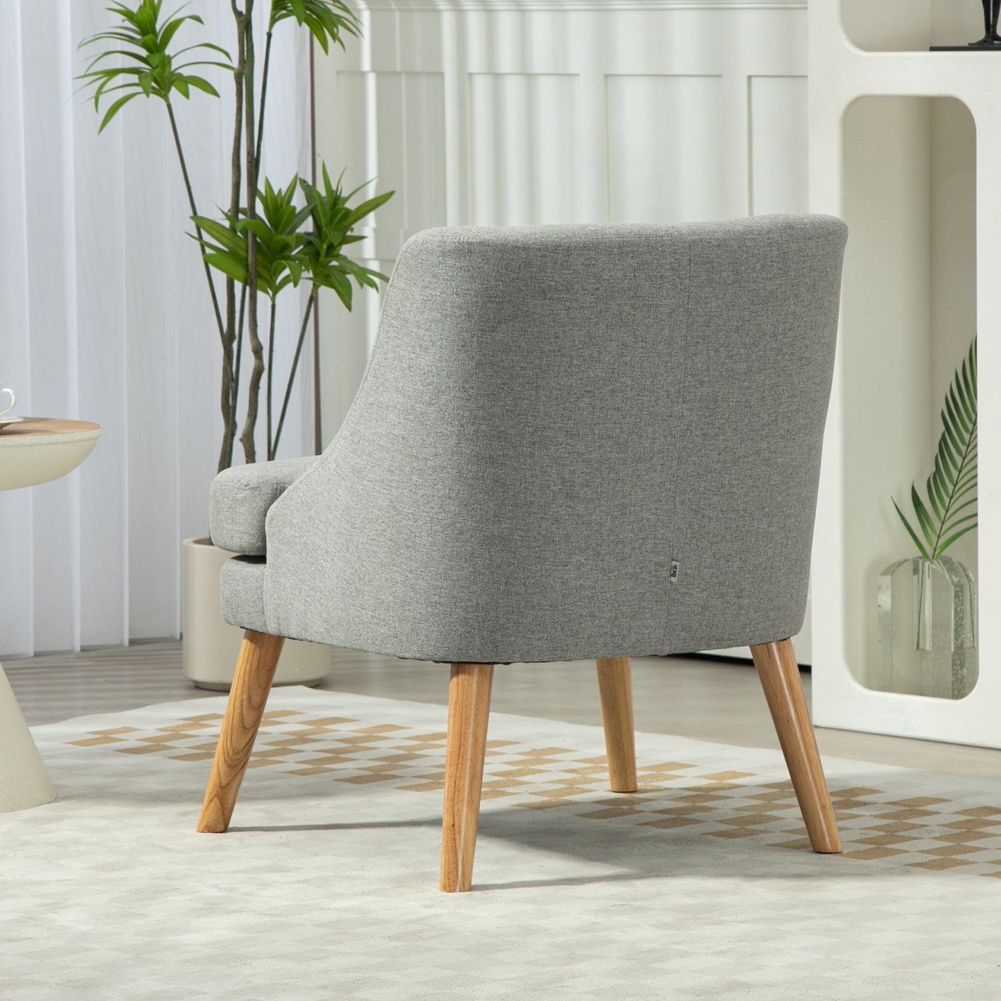 Light gray relaxation armchair in linen style with armrests