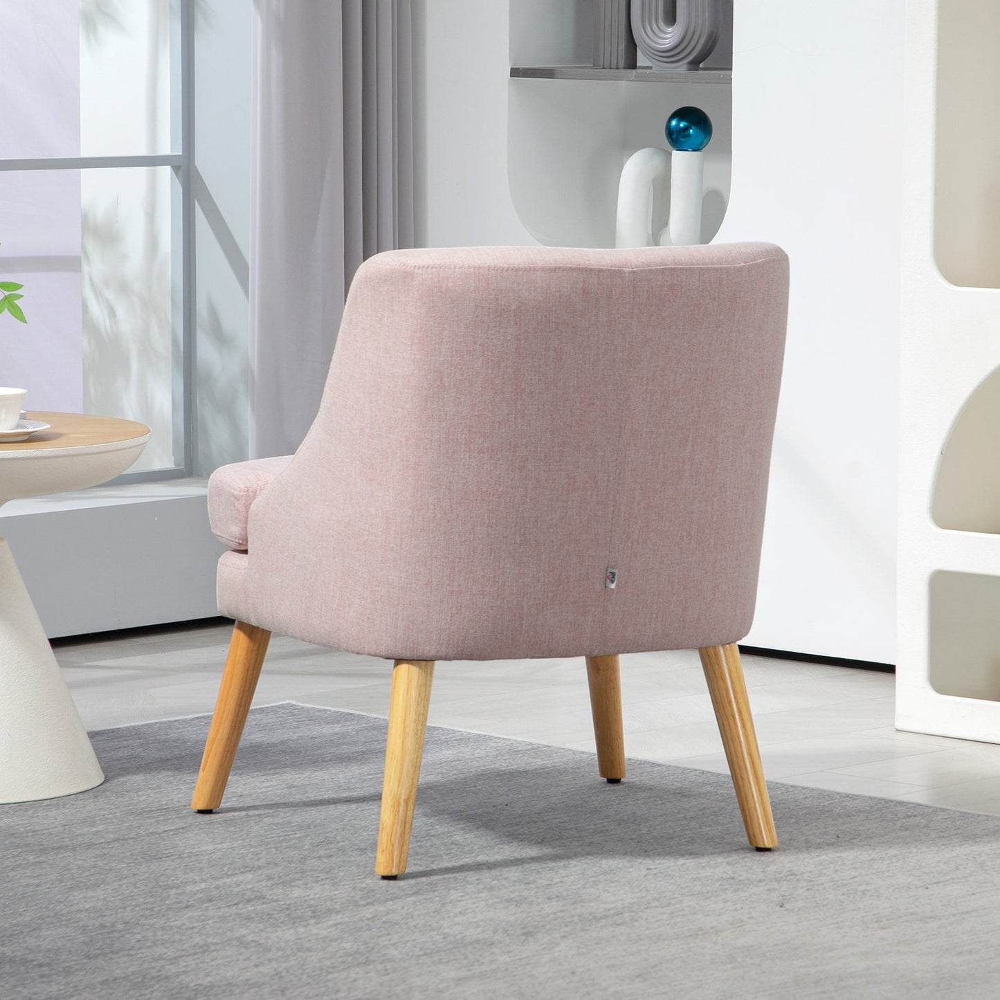 Pink lounge chair in linen look with armrests, wooden legs