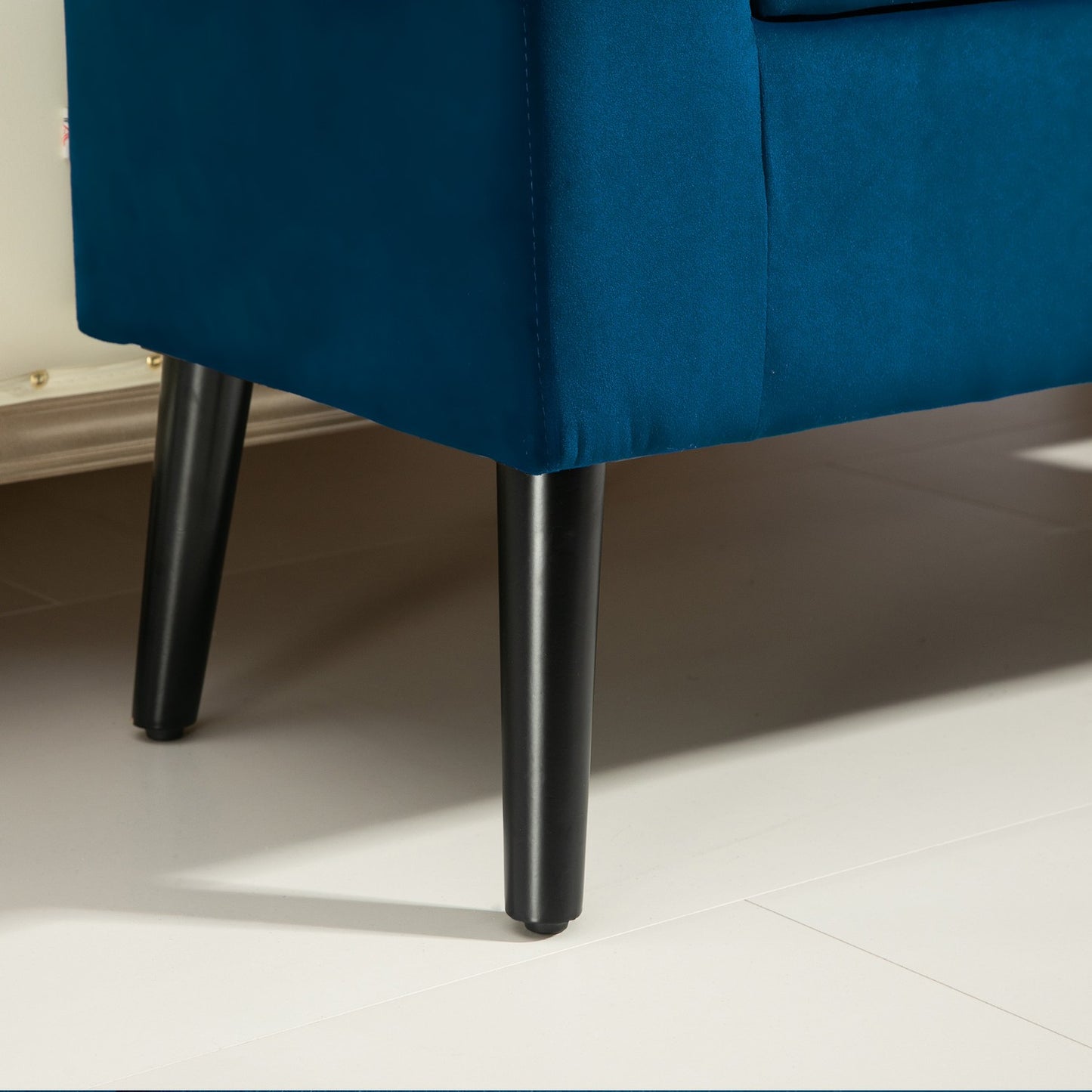 Velvet-covered storage bench with armrests, dark blue