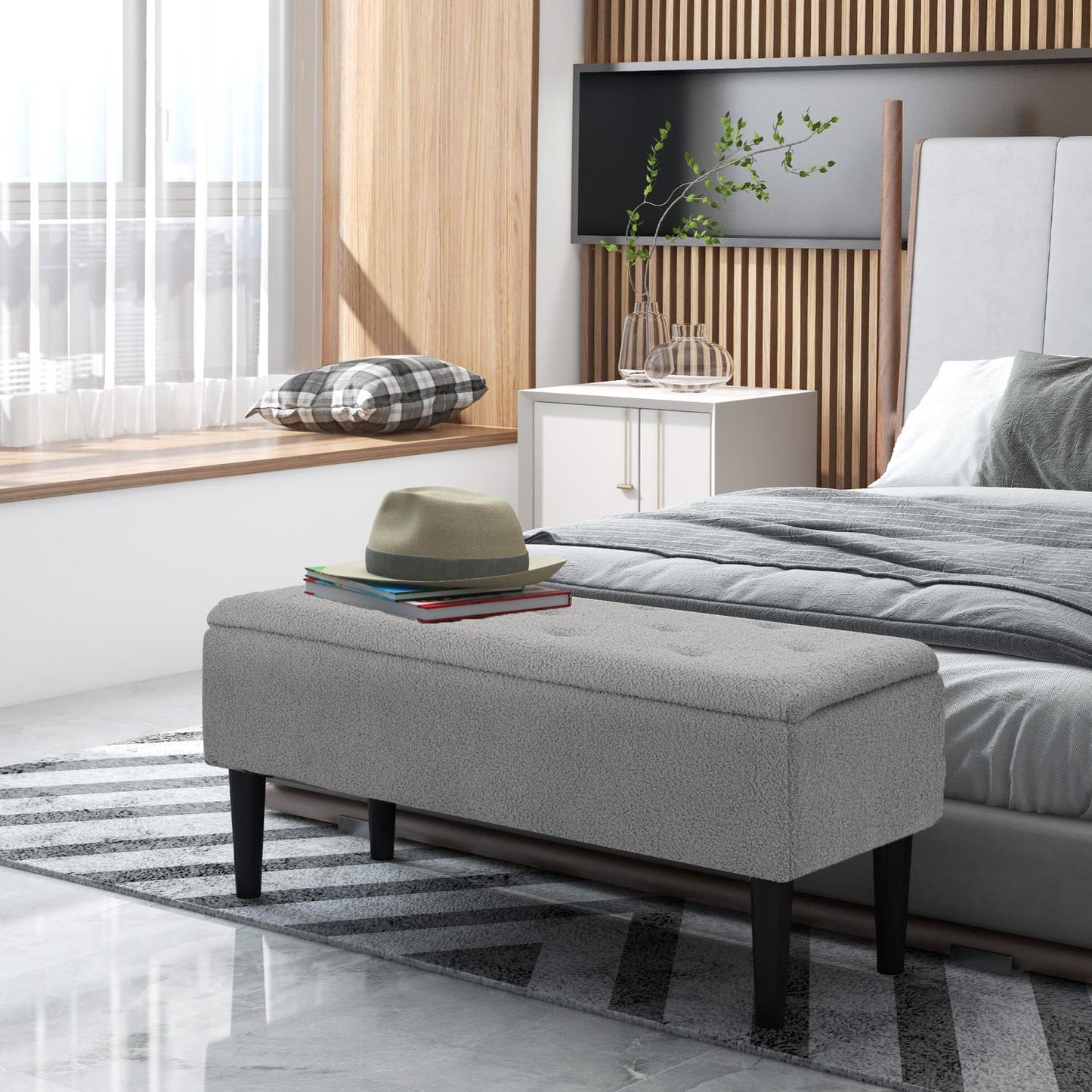Gray upholstered storage bench with hinged lid, 95 x 38 x 45 cm