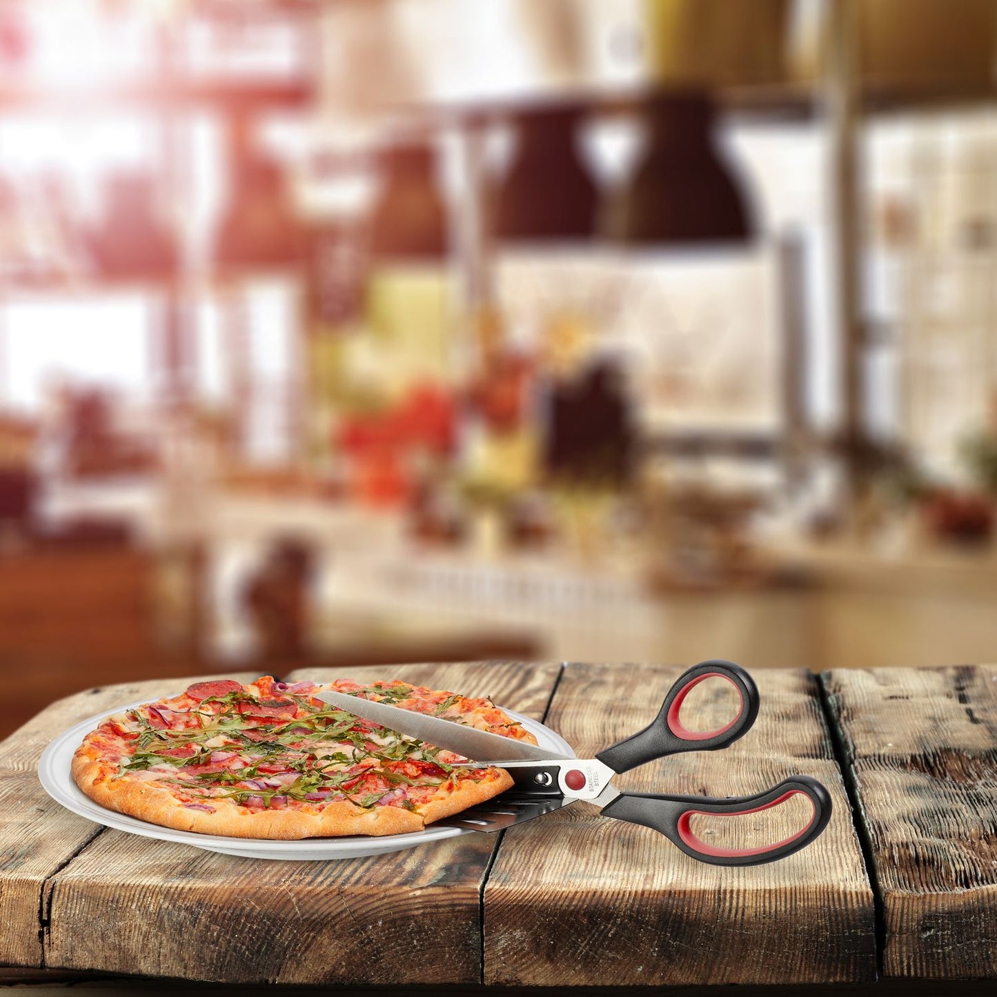 Black and red pizza cutter with lifting device