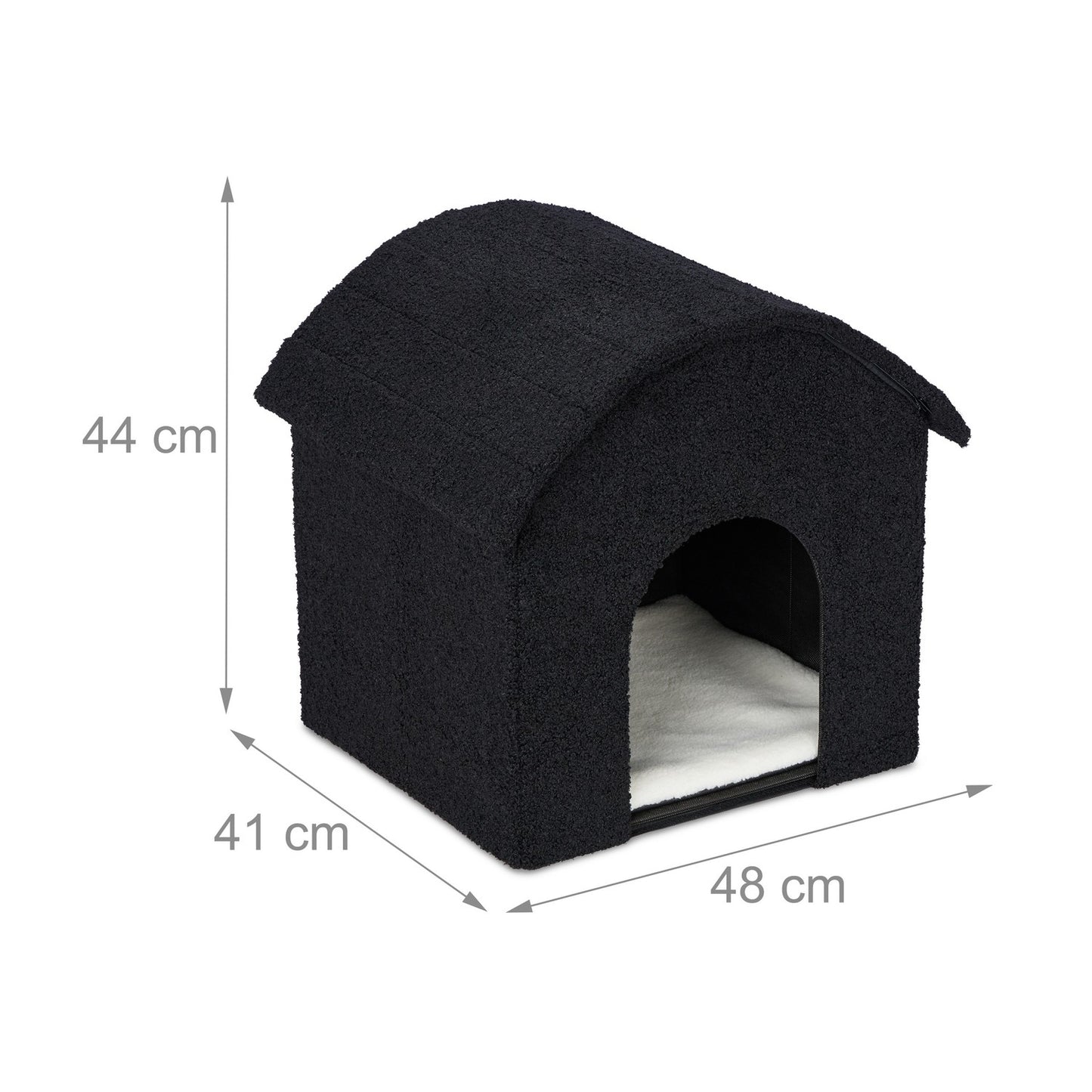 Black cat hide with scratching surface