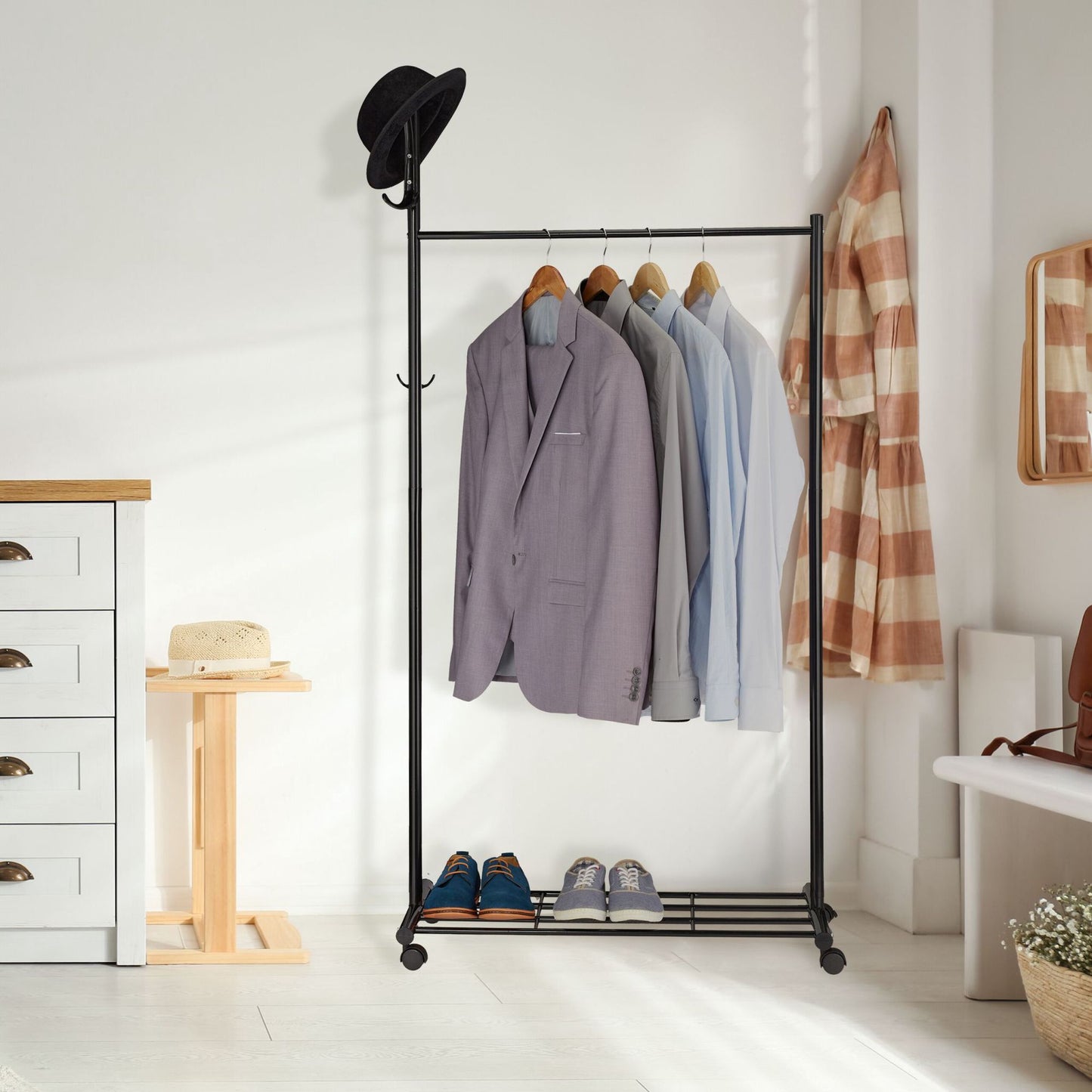 Black coat hanger with wheels