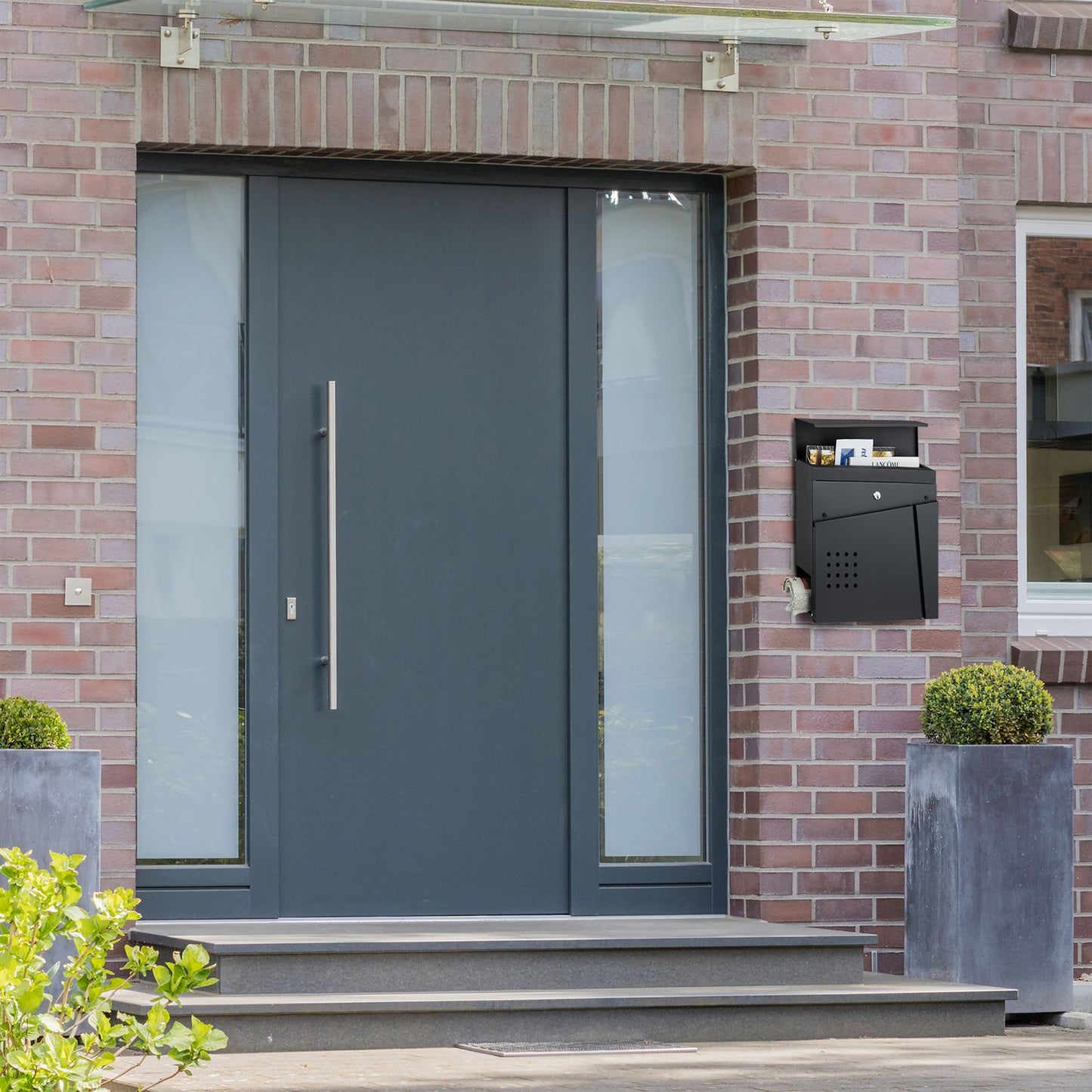 Black mailbox with newspaper holder