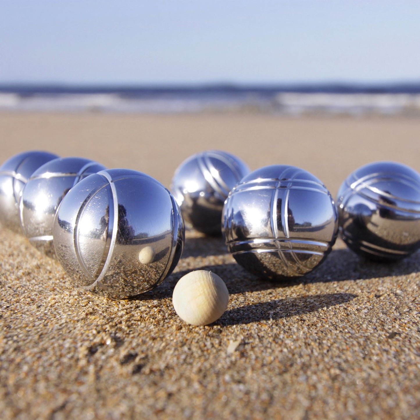Bowling game with six metal balls