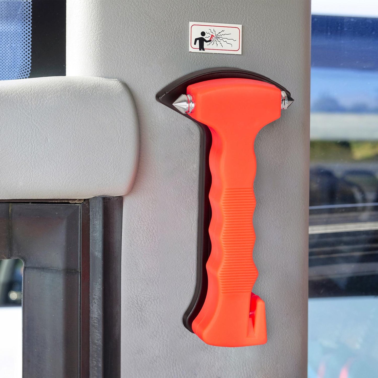 Car with emergency hammer and seat belt cutter