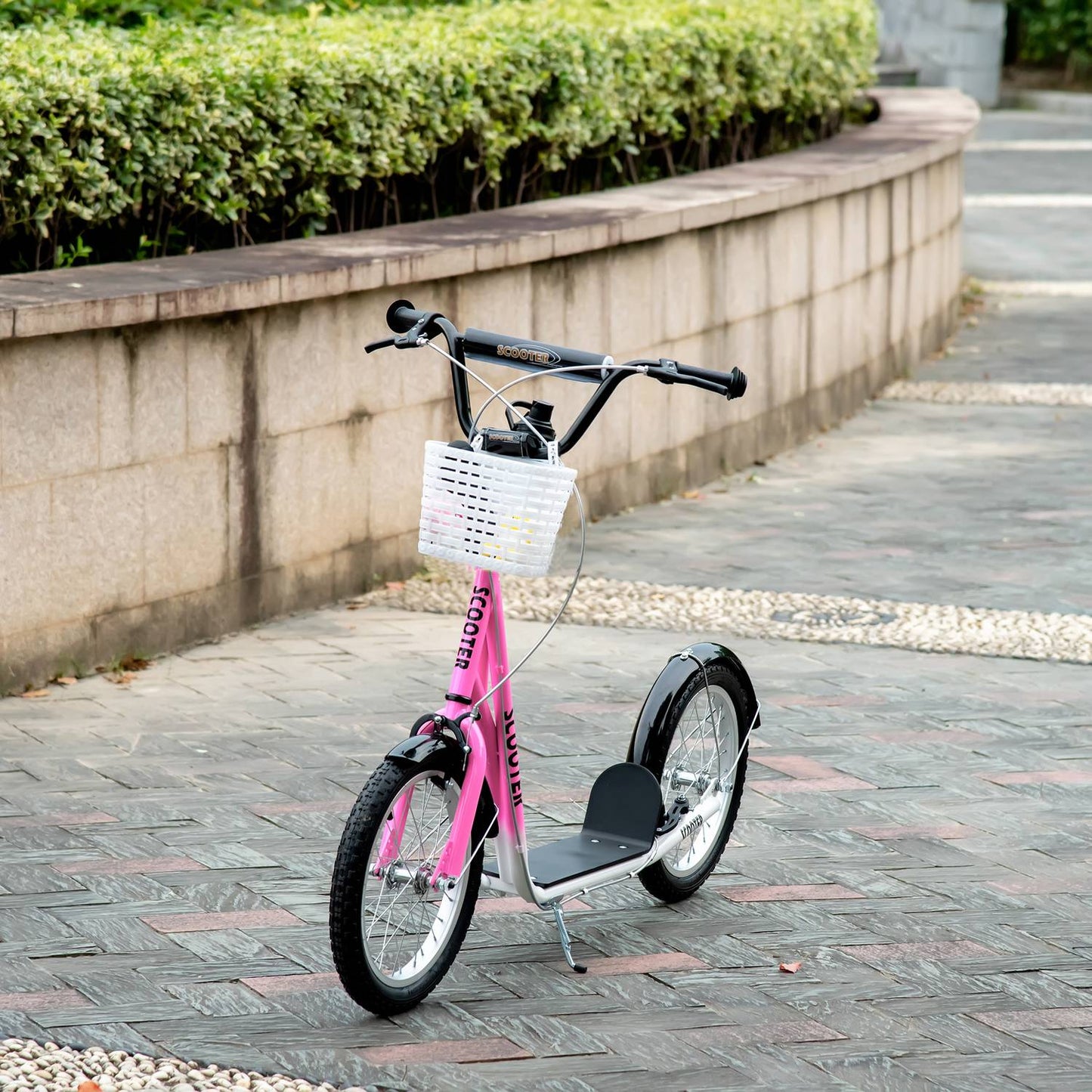 Children's scooter in pink and white, adjustable height, with basket