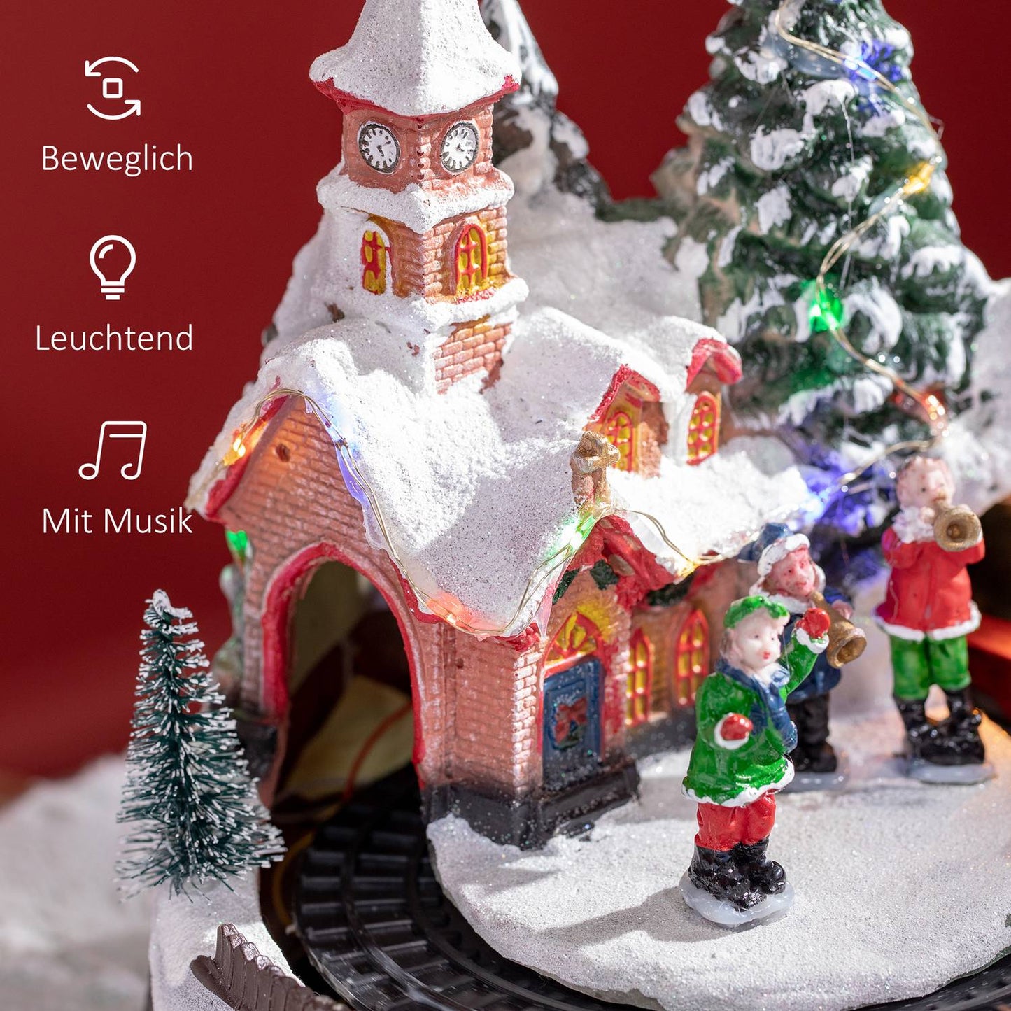 Christmas village with LED lights and moving train