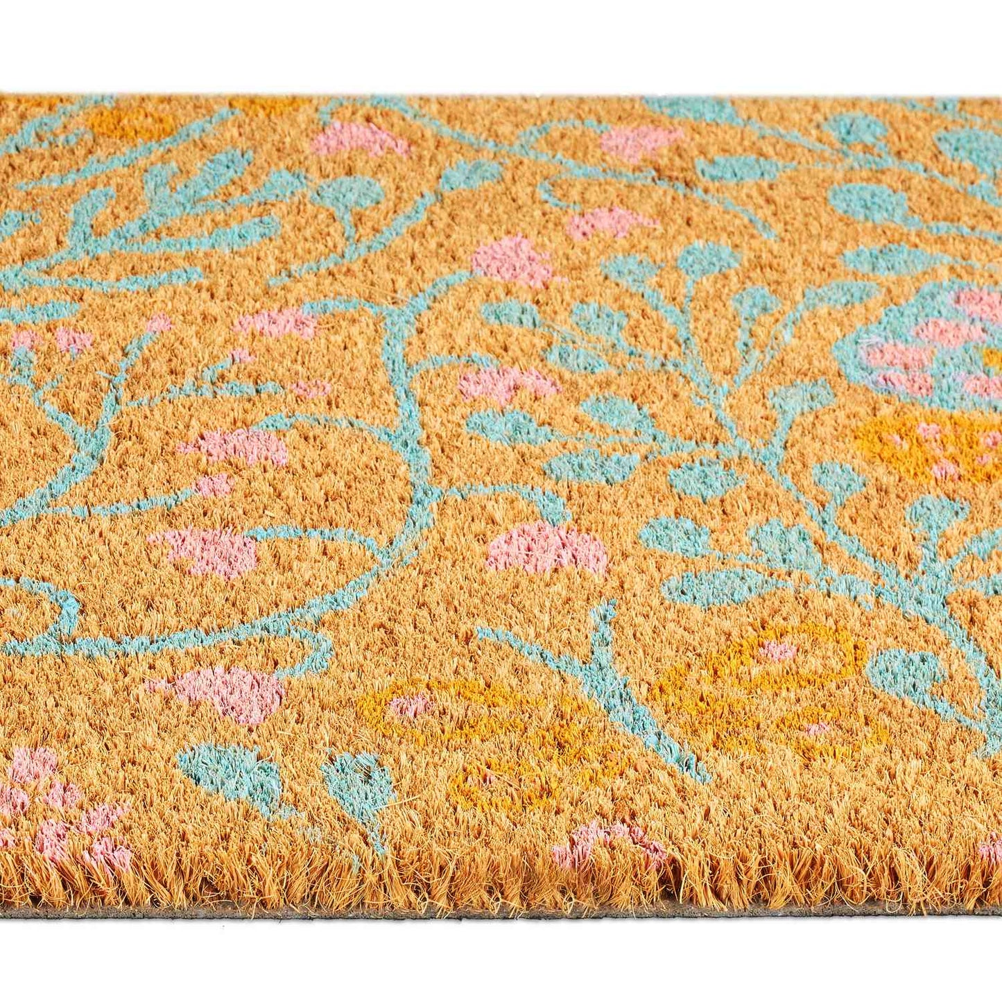 Coconut fiber doormat with a spring-like motif