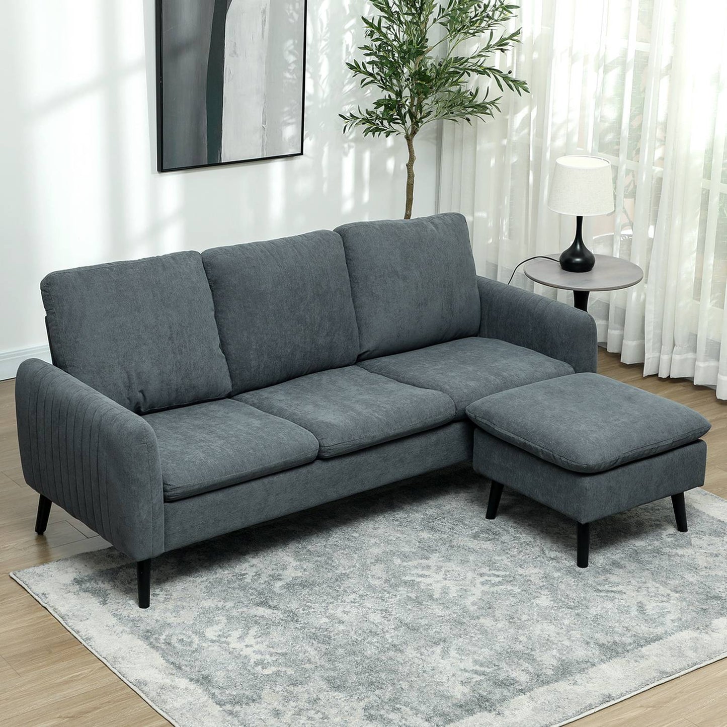 Gray L-shaped corner sofa with footstool & cushions