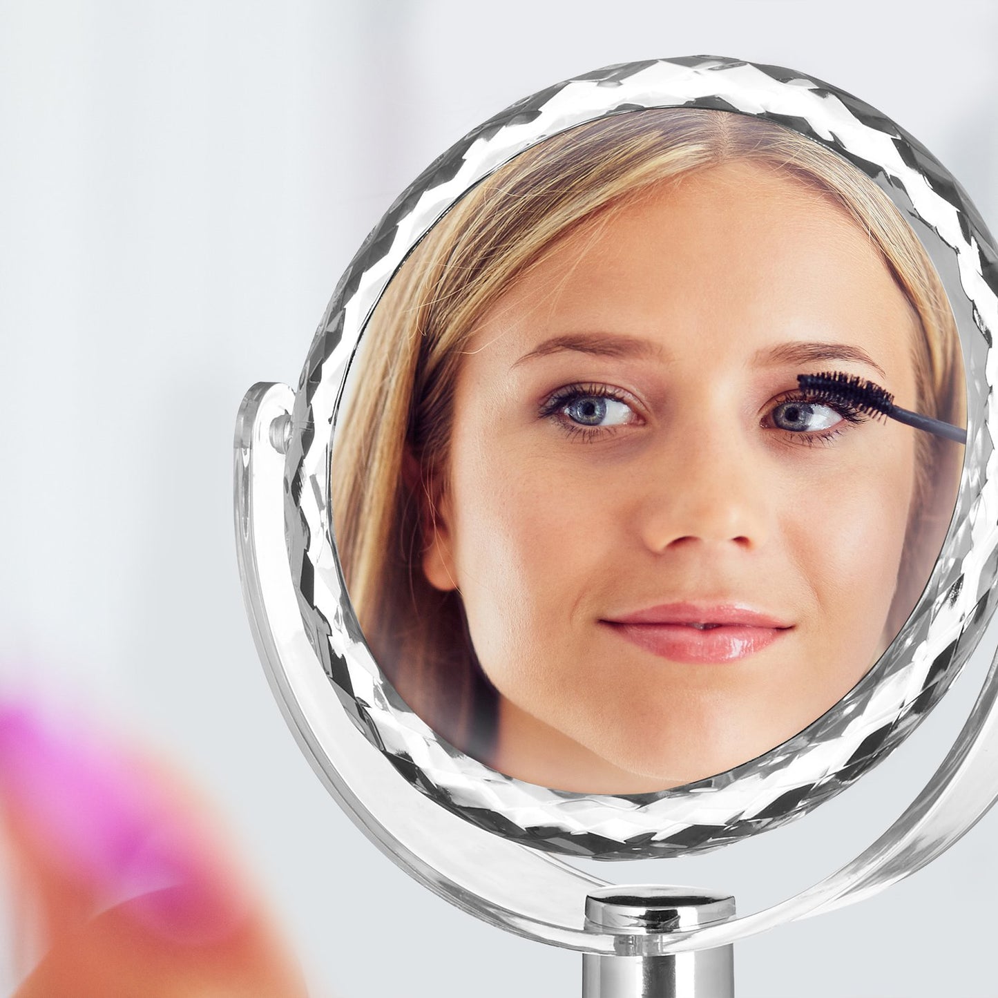Cosmetic mirror with magnification standing