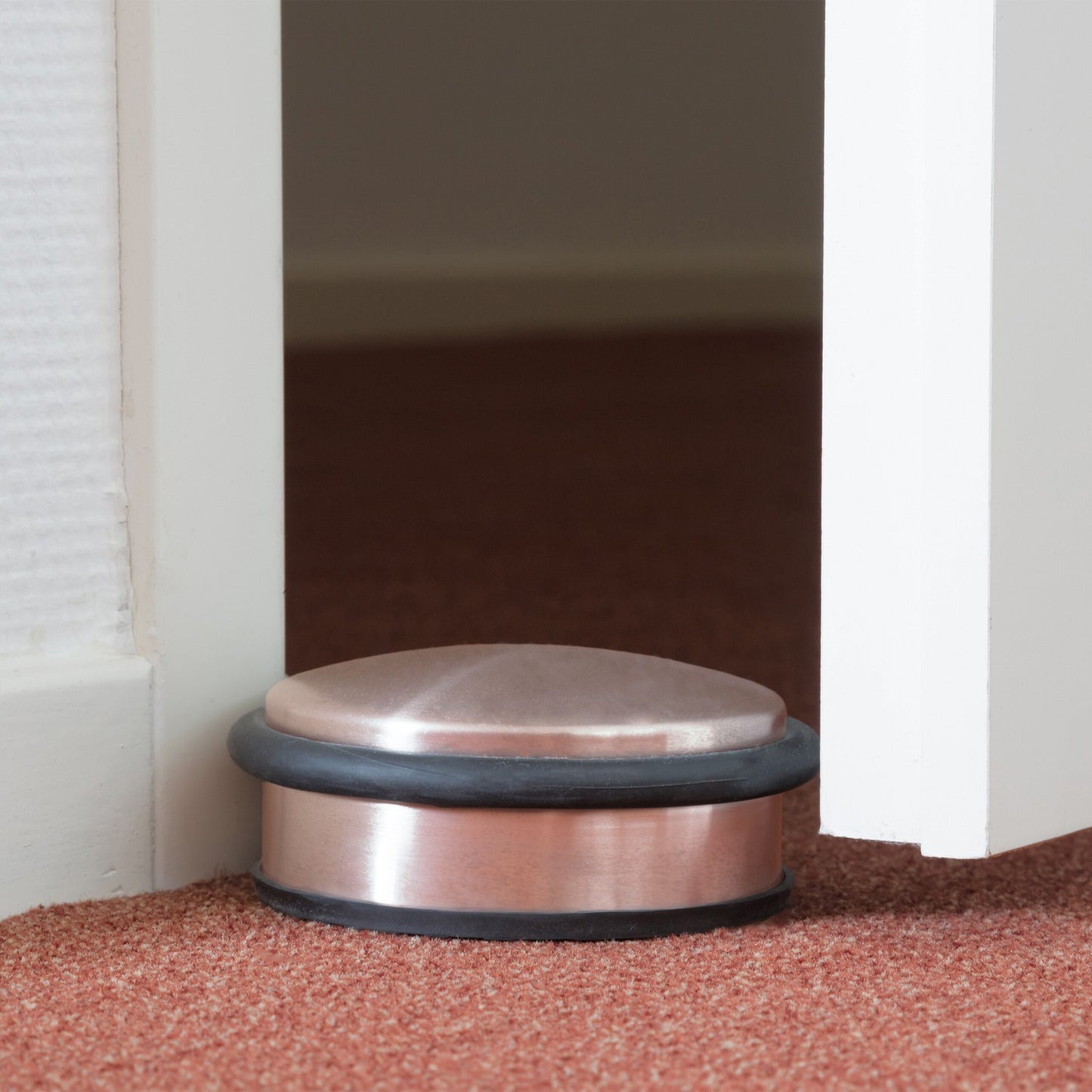 Door stop in stainless steel and bronze