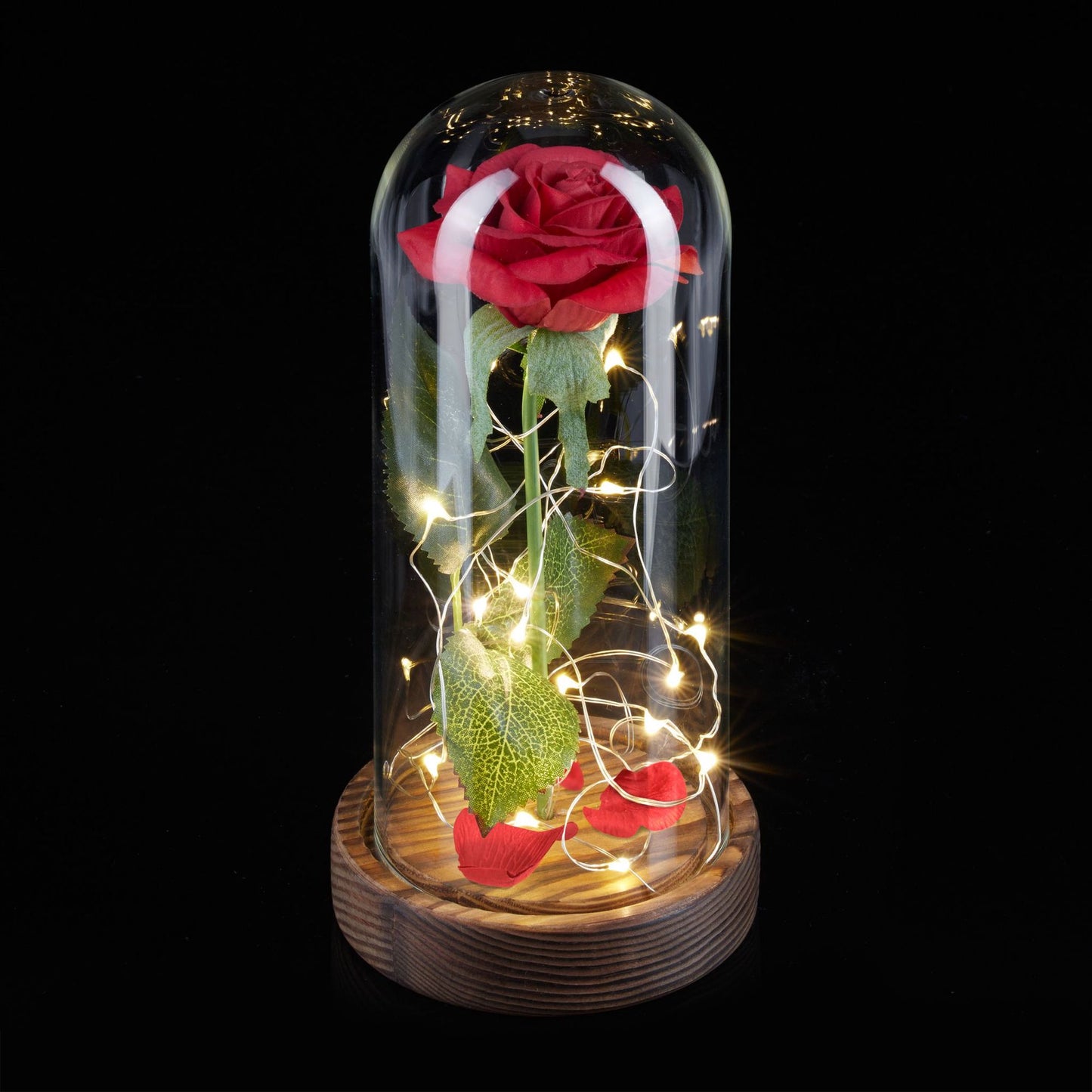 Eternal rose in glass with candle
