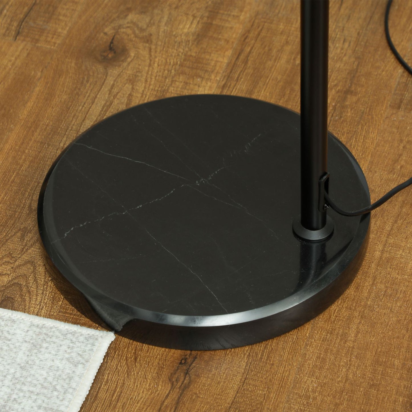 Adjustable black floor lamp with linen shade for the living room