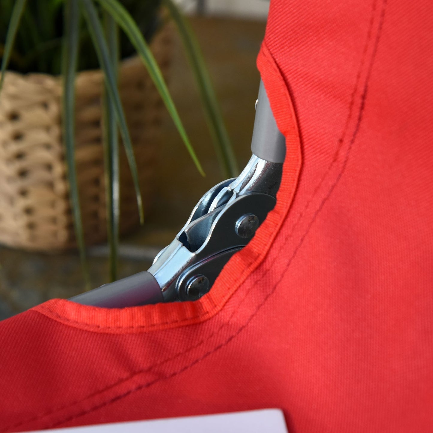 Red folding sun lounger, adjustable metal backrest