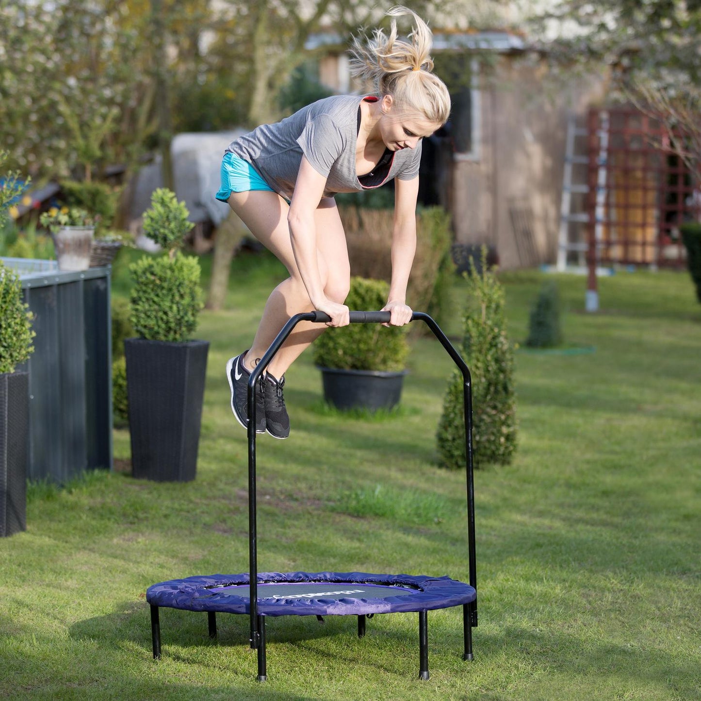 Foldable trampoline with handle