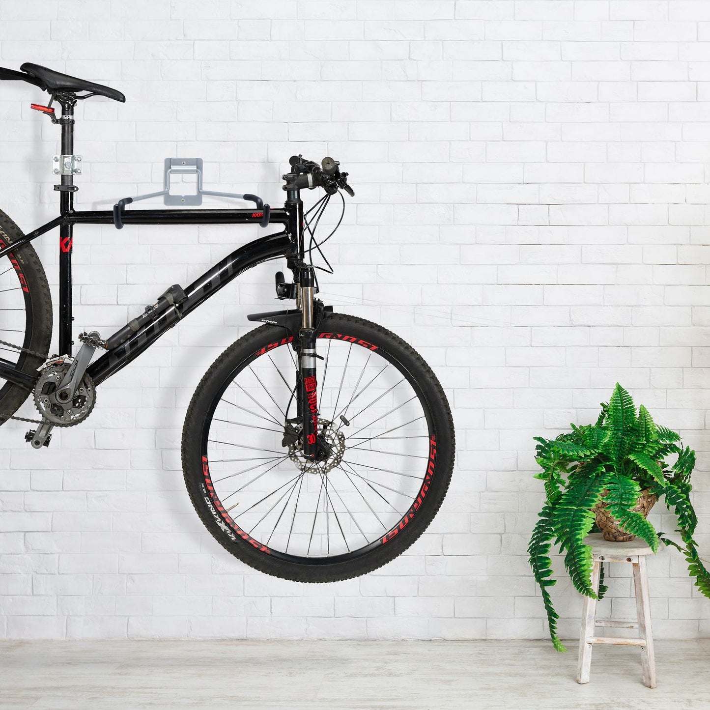 Folding wall bracket for bicycle