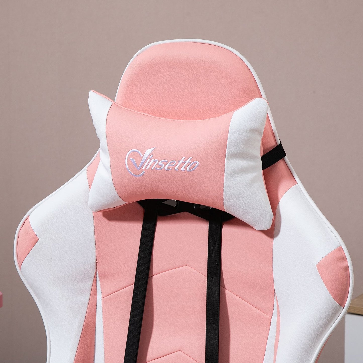 Ergonomic pink and white gaming chair with lumbar support