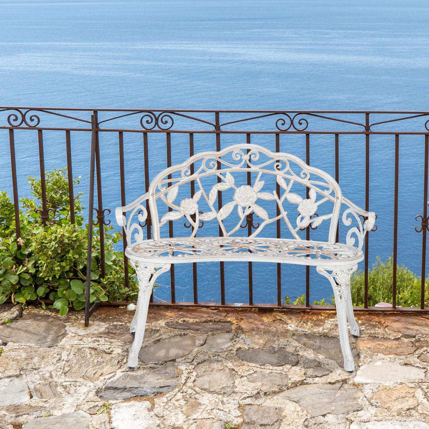 Garden bench white-bronze colored with roses