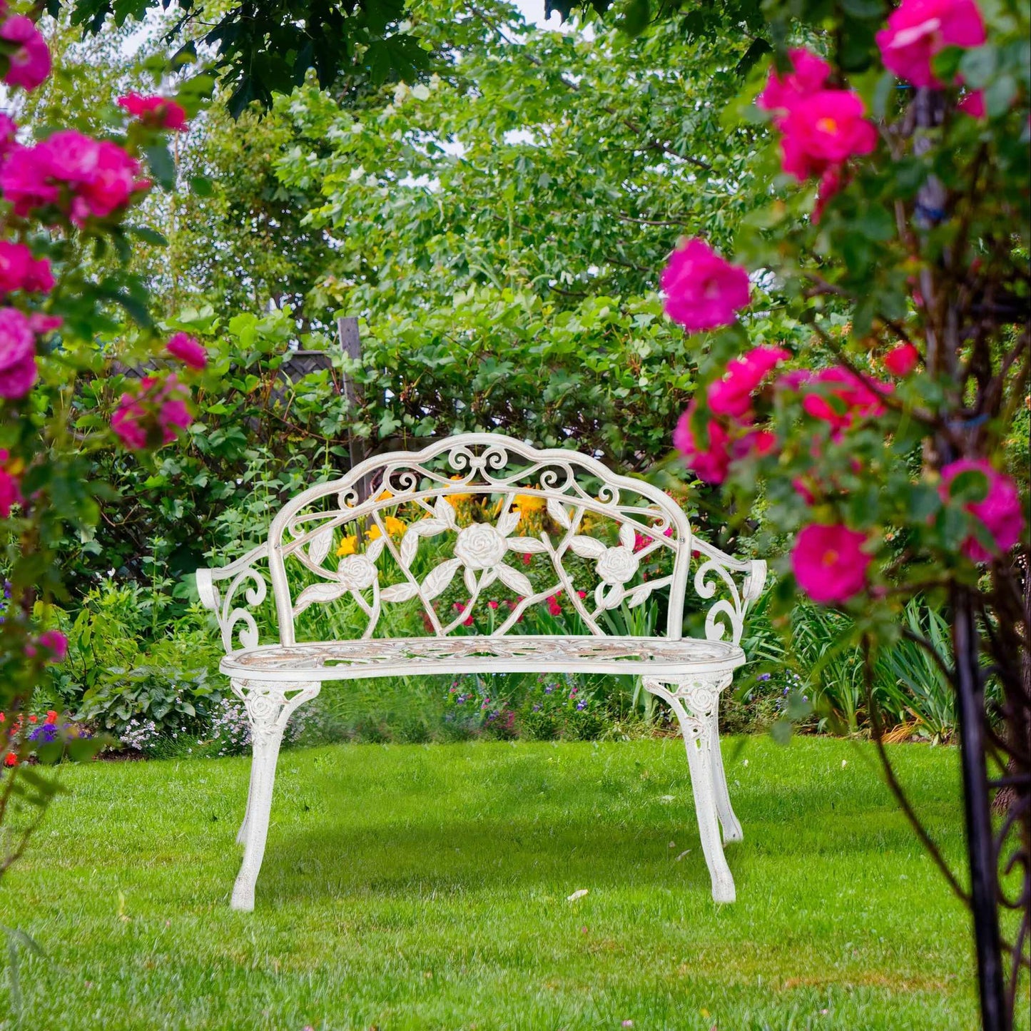 Garden bench white-bronze colored with roses