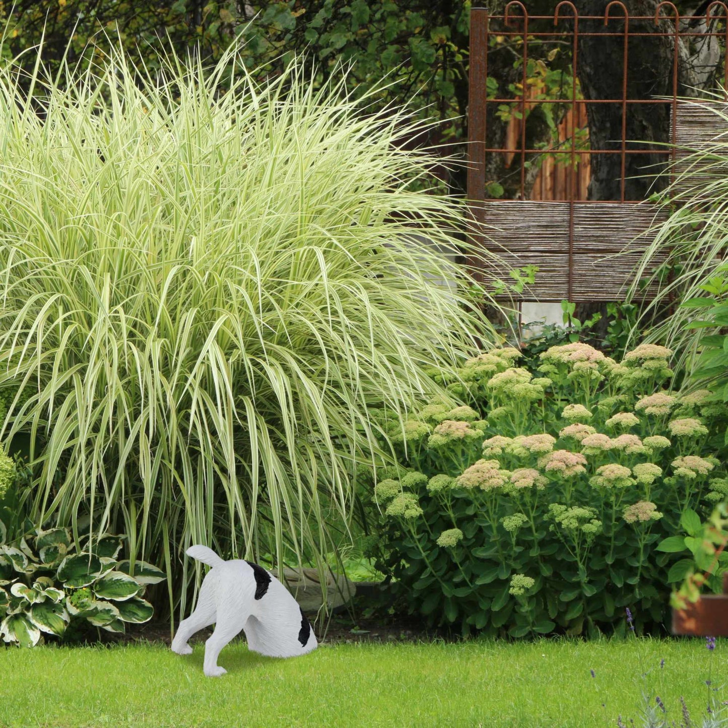 Garden figure digging dog