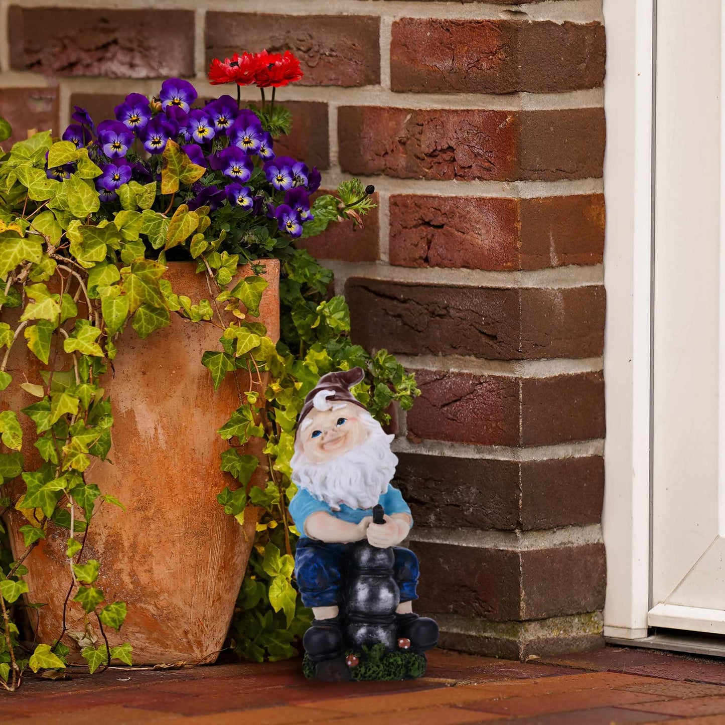 Garden gnome with water pump