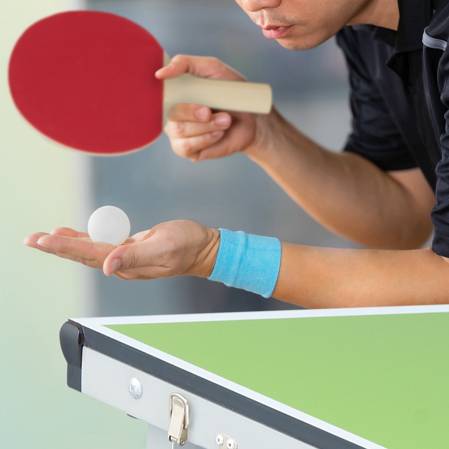 Green ping pong table with accessories