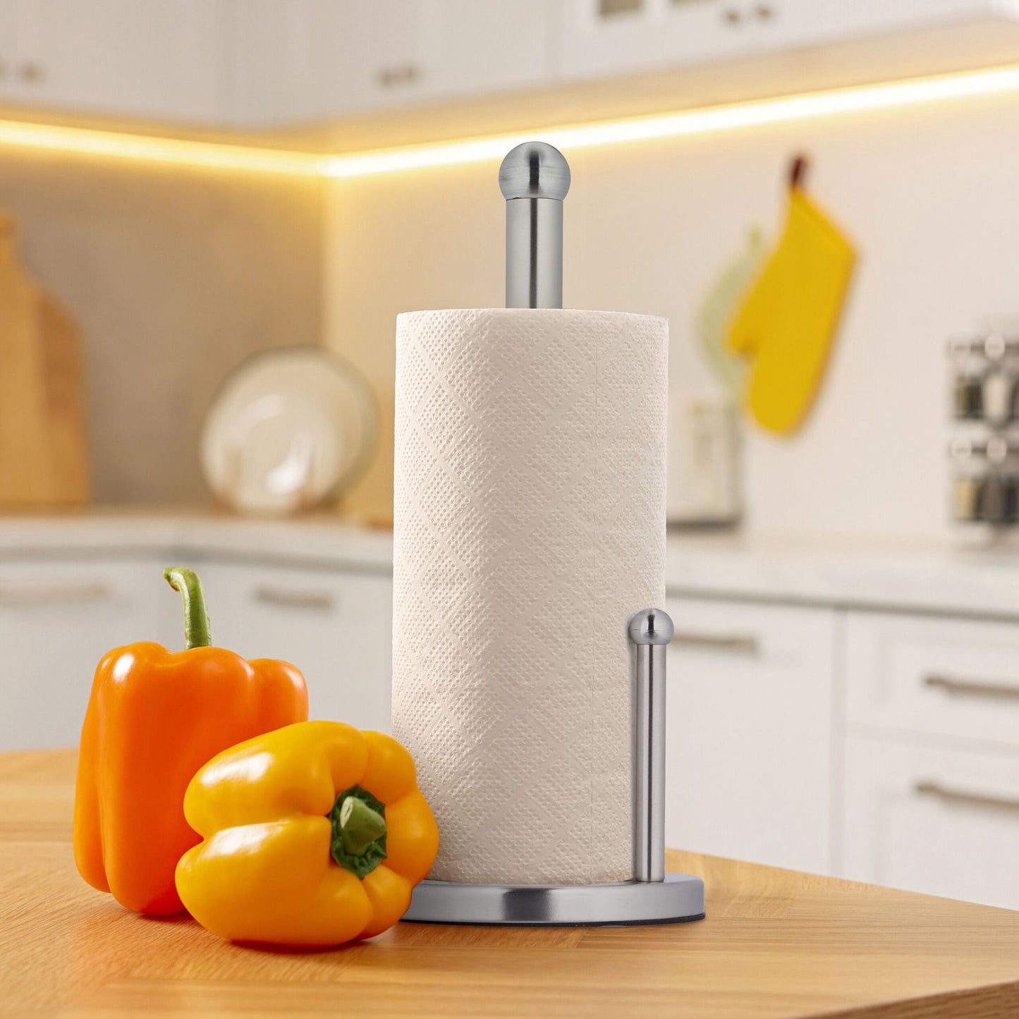 Holder for household paper in stainless steel