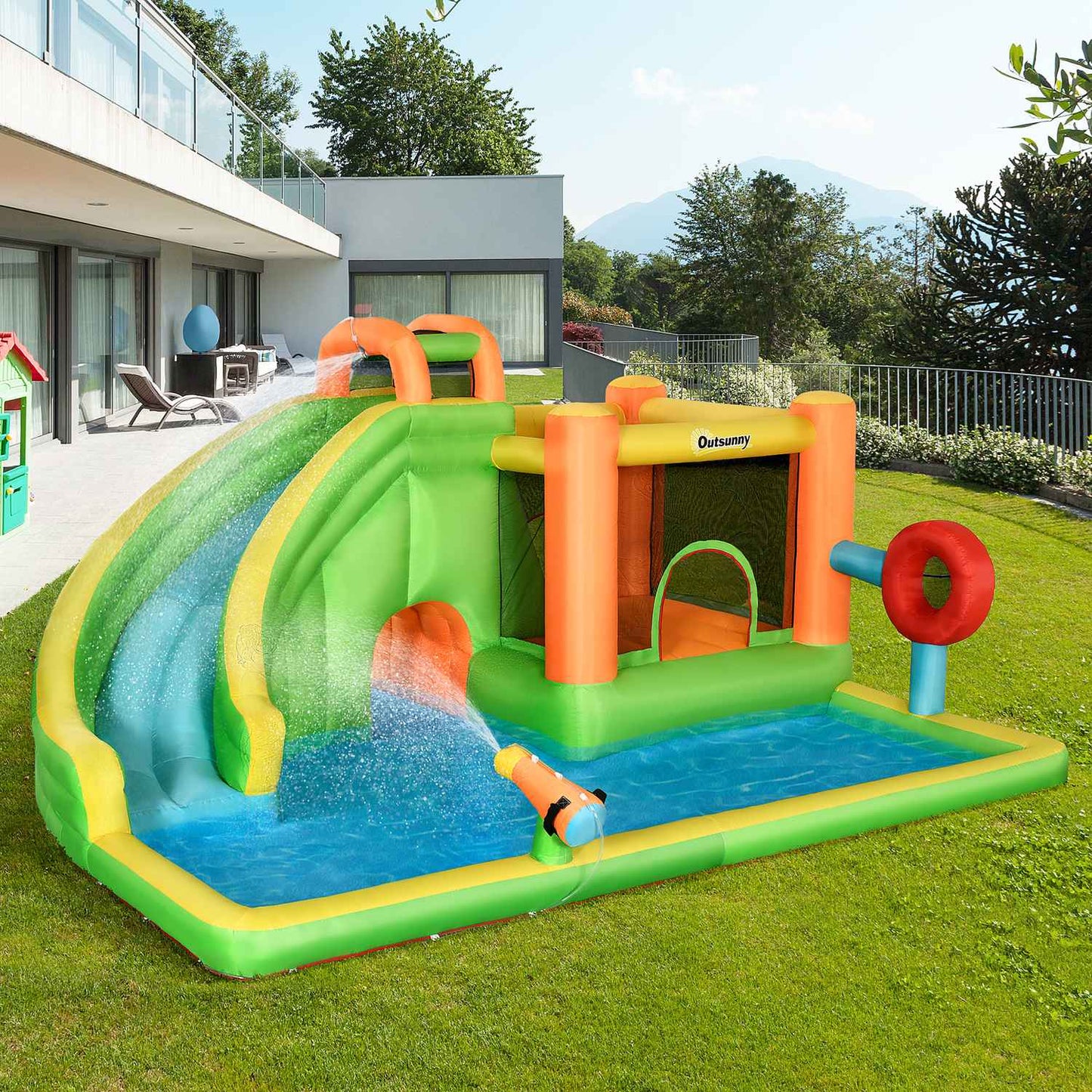 Inflatable bouncy castle with slide and water gun for children