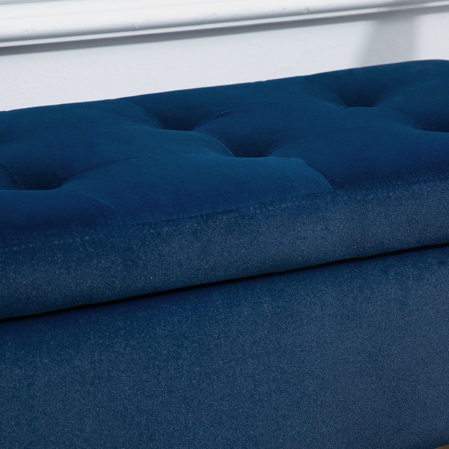 Blue upholstered storage bench, armrests, velvet finish