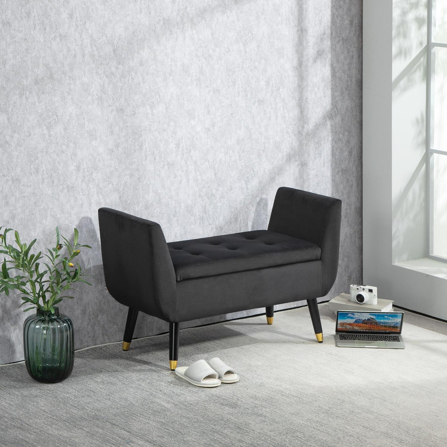Dark gray velvet upholstered storage bench with armrests